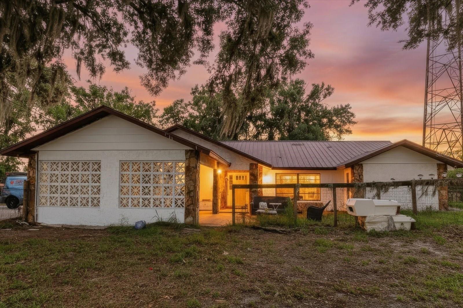 Welcome to this rare 5-acre property offering endless possibilities in a prime Hillsborough County location. The property will be cleared, and the 5 acres being conveyed with the sale will be leveled, providing a ready-to-use homesite with ample space for future improvements. The property features a single-family home with an attached 1-car carport and a detached 2-car garage/storage building, ideal for vehicles, equipment, hobbies, or additional storage. Zoned Agricultural Residential (AR) with NO HOA, NO CDD, and NO deed restrictions, this property offers the flexibility to bring your RVs, boats, work vehicles, animals, or create your own private retreat. Additional features include a private well, septic system, access to public utilities at the road, greenhouse potential, and space for equipment or construction storage. With over 160 feet of road frontage and convenient access to US 98, US 301, I-4, and I-75, the property is centrally located near Tampa, Brandon, Sun City Center, and Wesley Chapel. Please note: Public records reflect approximately 9.5 acres; however, the property will be subdivided, and approximately 5 acres, including the residence, will be conveyed at closing. Additional acreage may be available for purchase at a separately negotiated price. Don't miss this unique opportunity to own acreage in one of Hillsborough County's most accessible and desirable locations. Schedule your private showing today.