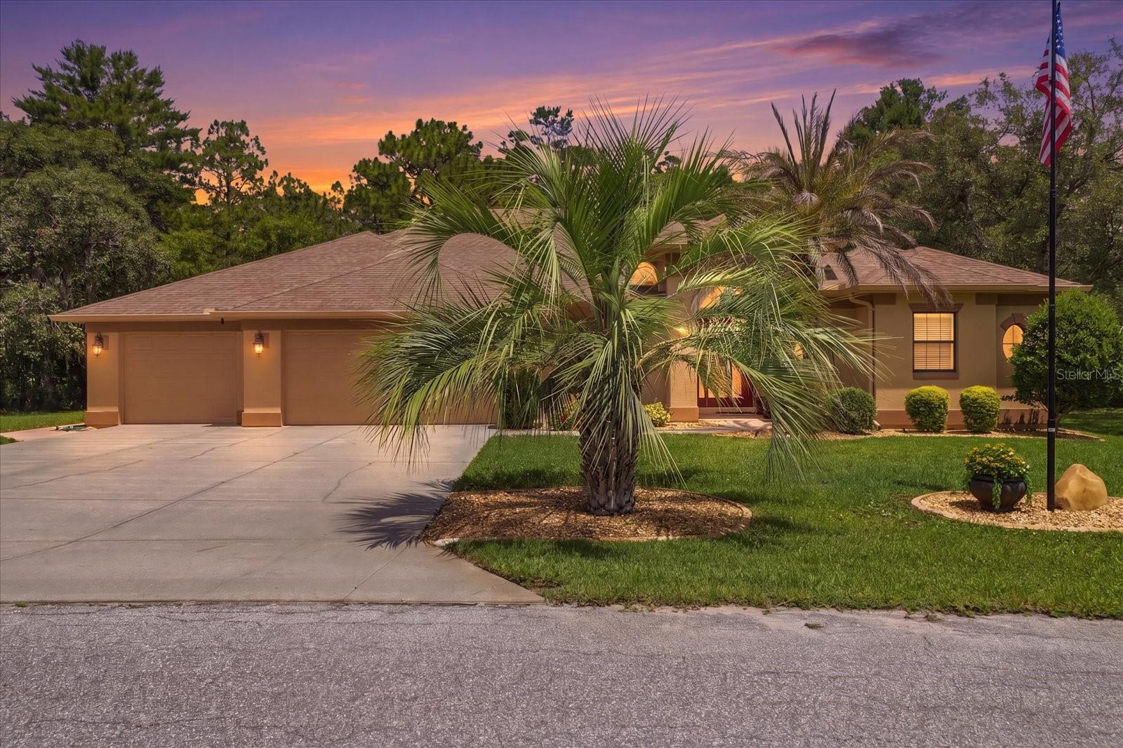 Welcome to this beautifully maintained 3-bedroom, 2-bath home offering 2,164 square feet of thoughtfully designed living space and a 3-car garage, tucked away on a quiet cul-de-sac and backing to a peaceful greenbelt in the desirable Sugarmill Woods community.

Step inside to discover an elegant formal living room and formal dining room, perfect for entertaining and everyday comfort. The spacious kitchen is a chef’s delight, featuring stunning Zodiak Quartz countertops, Medford Arch Maple cabinetry, under-cabinet lighting, and an open layout flowing seamlessly into the breakfast nook and inviting family room. Cathedral and Tray ceilings with crown molding and soft accent lighting create a warm and sophisticated atmosphere throughout the main living areas.

Outdoor living is exceptional with a beautiful, spacious lanai overlooking a heated pool and hot tub — your own private Florida retreat. For added peace of mind, all doors leading to the pool area are equipped with a child-protective security system.

The generous primary suite offers dual walk-in closets and a large en-suite bathroom with dual sinks and plenty of storage. A desirable split floor plan provides privacy for family and guests, with two additional bedrooms located on the opposite side of the home. Granite countertops enhance the bathrooms, while the oversized laundry room offers Corian countertops with abundant cabinetry and closet space.

Enjoy the relaxed lifestyle of Florida’s Nature Coast, with nearby spring-fed rivers leading to the Gulf of America for year-round fishing, boating, kayaking, and paddleboarding. Convenient access to the Suncoast Parkway makes travel to Tampa, the airport, shopping, dining, beaches, and entertainment quick and easy. Optional community amenities within Sugarmill Woods provide even more opportunities to enjoy the Florida lifestyle. One or more photo(s) has been virtually staged.
