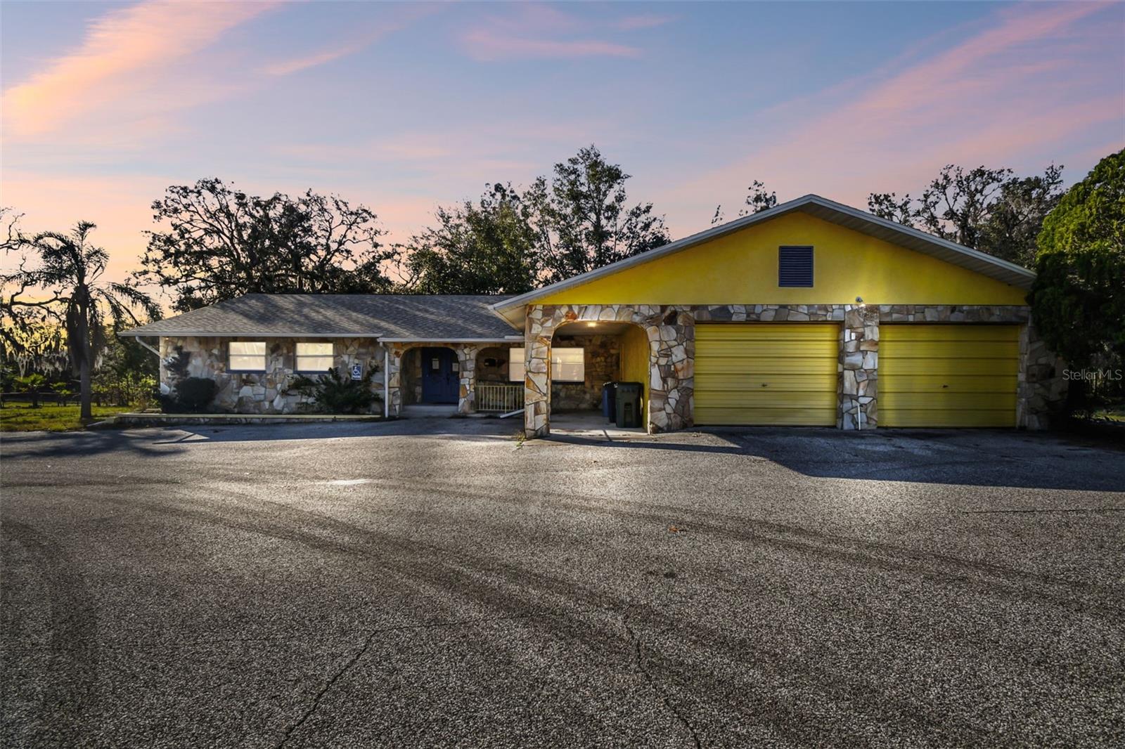 Seize this rare opportunity to own a 2,300+ sq. ft. commercial property situated on over an acre along Little Road, a highly traveled six-lane corridor offering outstanding exposure and accessibility. With close proximity to SR 52, US-19, the Suncoast Parkway, and public transportation, this location is ideal for businesses seeking visibility and convenience.

Formerly operated as a chiropractic office, the property is designed for maximum flexibility, making it suitable for a wide range of professional, medical, or commercial uses. The building features no interior load-bearing walls, allowing for easy customization and reconfiguration to fit your business needs. Two curb cuts and a circular driveway provide seamless ingress and egress, while over a dozen paved parking spaces accommodate clients and staff. The property also offers an ADA-compliant entrance ramp and restroom, a spacious reception area with administrative office space, an integrated garage/storage area, a kitchen or break room for staff convenience, and a functional illuminated monument sign for excellent street visibility. The load-bearing structural setup supports easy interior modifications.

Additional amenities include two full bathrooms and two half bathrooms, a rear screened porch, and a paved rear patio, offering flexibility for expansion, outdoor workspace, or guest-use areas. A new roof installed in 2020 adds long-term value and peace of mind.

In addition to its commercial appeal, the property also presents a unique opportunity for conversion to an income-producing short-term rental or Airbnb-style use, subject to zoning and local regulations, making it attractive to investors seeking versatility and multiple revenue streams.

This highly visible, easily accessible, and adaptable property offers endless possibilities. Schedule your private tour today and explore the potential!