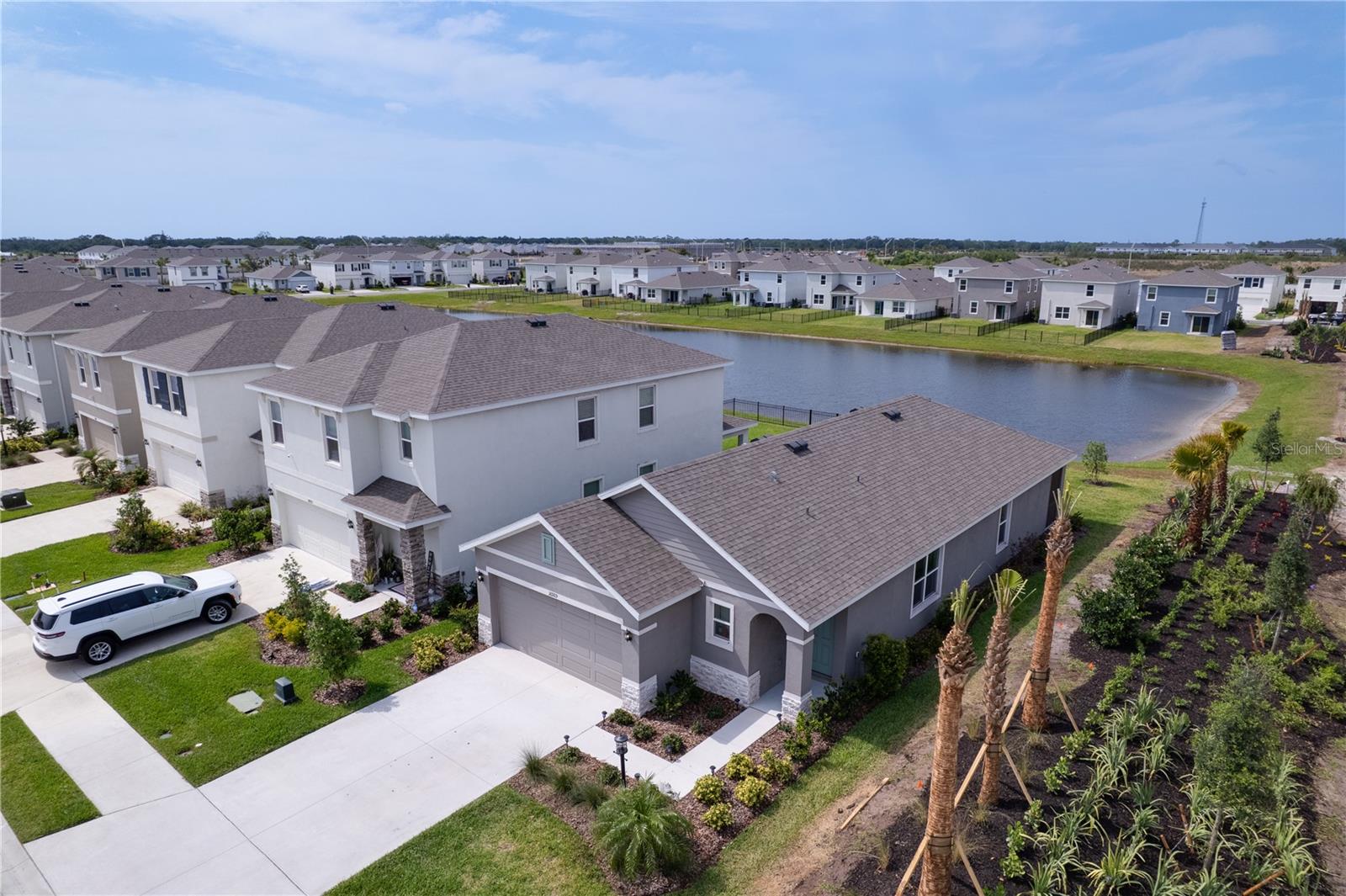 This Allex floor plan in DR Horton’s Star Farms community is situated on a corner lot with a pond view. With 3 bedrooms and 2 baths, you have the ultimate in privacy with primary bedroom split from the guest bedrooms. With tile floors throughout the living areas and carpeting in the bedrooms, this home features a roomy kitchen and great room combination, plus a screened in lanai overlooking the pond. Built in 2024, this home comes with all stainless appliances and has an inside utility room equipped with a washer and dryer. Lawn maintenance and internet are included! This resort community with an impressive amenity center includes a beautiful pool, tennis, Pickleball, a café style restaurant, a poolside restaurant and fitness center. Lots of planned activities will keep you busy too. This home is unfurnished and available for an annual rental or longer!