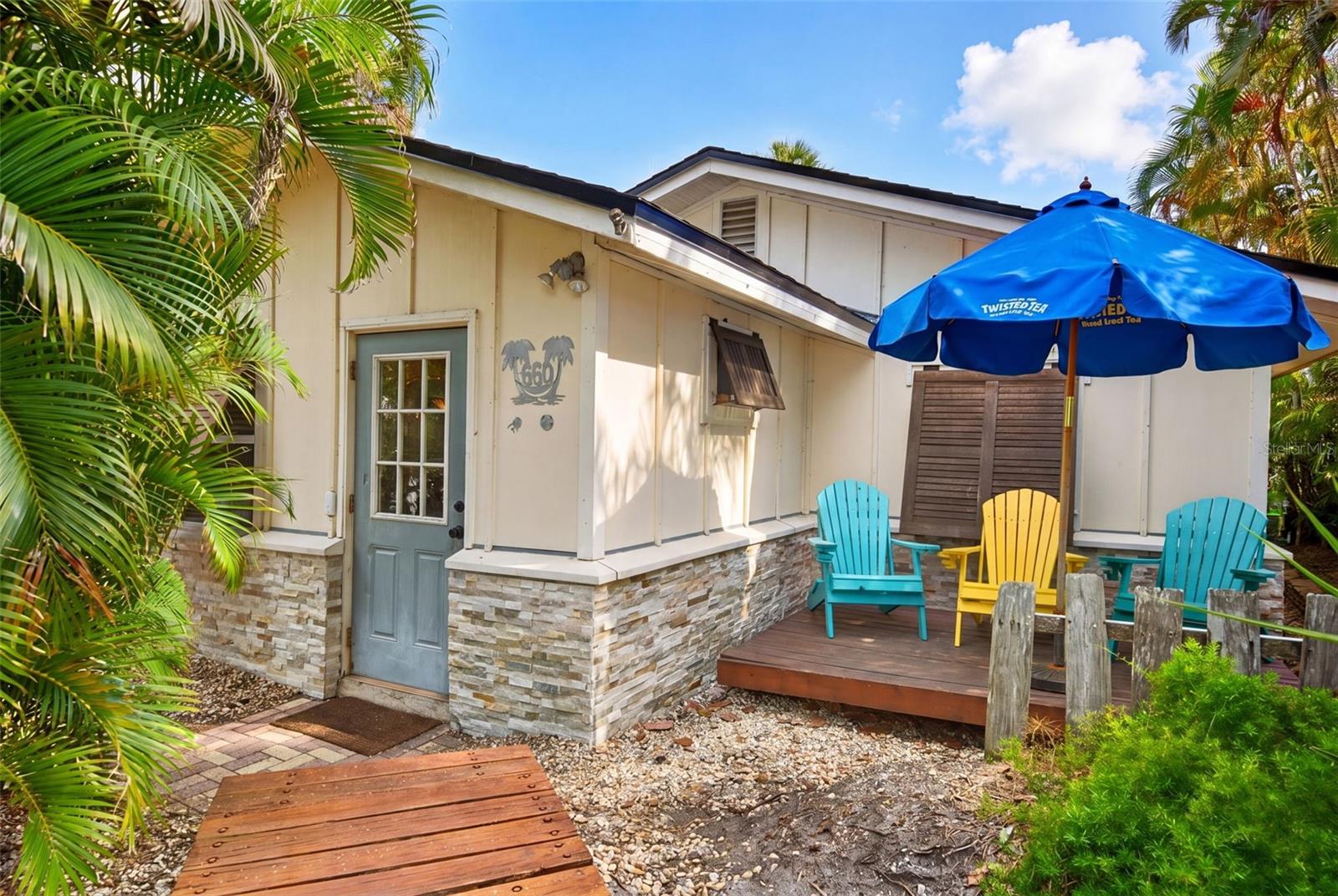 Owner Financing Available! Nestled in the heart of Longboat Key's coveted historic Longbeach Village, this exceptional island retreat offers 3 bedrooms and 3 bathrooms across two charming Key West-style cottages just moments from both the most pristine Gulf beaches and beautiful Sarasota Bay. This rare property blends timeless coastal elegance with modern updates in a private, landscaped setting. The main residence features a bright, open floor plan and an updated kitchen with quartz countertops, hardwood cabinetry, newer appliances, and abundant natural light. The detached guest cottage offers a private 1-bedroom, 1-bath layout complete with its own kitchen and entrance, providing the perfect space for guests, extended family, or added flexibility. Outdoor living is equally inviting with a spacious entertaining deck, tiki bar, and mature tropical landscaping that creates a true sense of privacy and retreat, with room to add a pool. Recent improvements include a new roof on the main residence (2026), Hardie Board siding, updated cabinetry, quartz countertops, updated appliances throughout, fresh paint, and a newer A/C system, offering peace of mind and modern comfort. With proven rental income, this property serves as an exceptional investment opportunity while maintaining strong personal use potential. Situated in the highly desirable “Village“, one of the most charming, inviting, and community-driven neighborhoods on Longboat Key, residents enjoy a rare blend of coastal character and close-knit island living. Just moments from Whitney Beach, community fishing docks, a boat and kayak launch, and exclusive waterfront dining destinations such as Mar Vista and The Shore, this home captures the essence of luxury island living in one of the island’s most beloved enclaves. Schedule your private showing TODAY before it’s gone !!