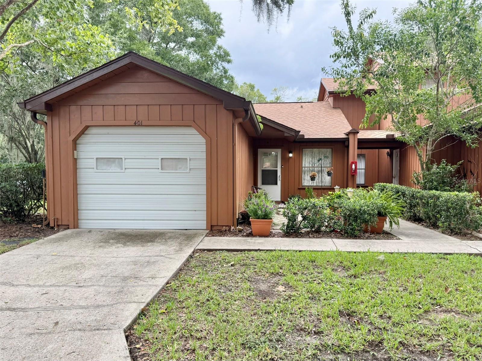 Welcome home to this lovely end unit condo in Oakbrook Village!  This is a one-story two bedroom two bathroom condo with attached one car garage and private porch.  As you arrive, you are first greeted by a paver patio surrounded by flowering plants, creating a warm and inviting entrance.  Step inside to an open floor plan with combined living and dining area, ideal for everyday living and for entertaining.  Just off the dining area, the 10' by 12' screen enclosed porch with stacking vinyl film windows is another wonderful place to unwind and enjoy your favorite beverage.  The kitchen has a pantry closet and lots of counter space that includes seating for two.  The primary bedroom has an ensuite bathroom with walk in shower.  The second full bathroom is ideally situated between the guest bedroom and the main living area and has a tub.  There is a community pool perfect for these warm Florida days, as well as an outdoor clubhouse and racquetball court. The condo association takes care of all outside maintenance, pool maintenance, pest control, and trash pickup, so when you come home, you can RELAX!!  Come enjoy the low maintenance lifestyle and the convenient location that is close to restaurants, shopping, parks, and medical facilities!  Make your appointment to see this one TODAY!!