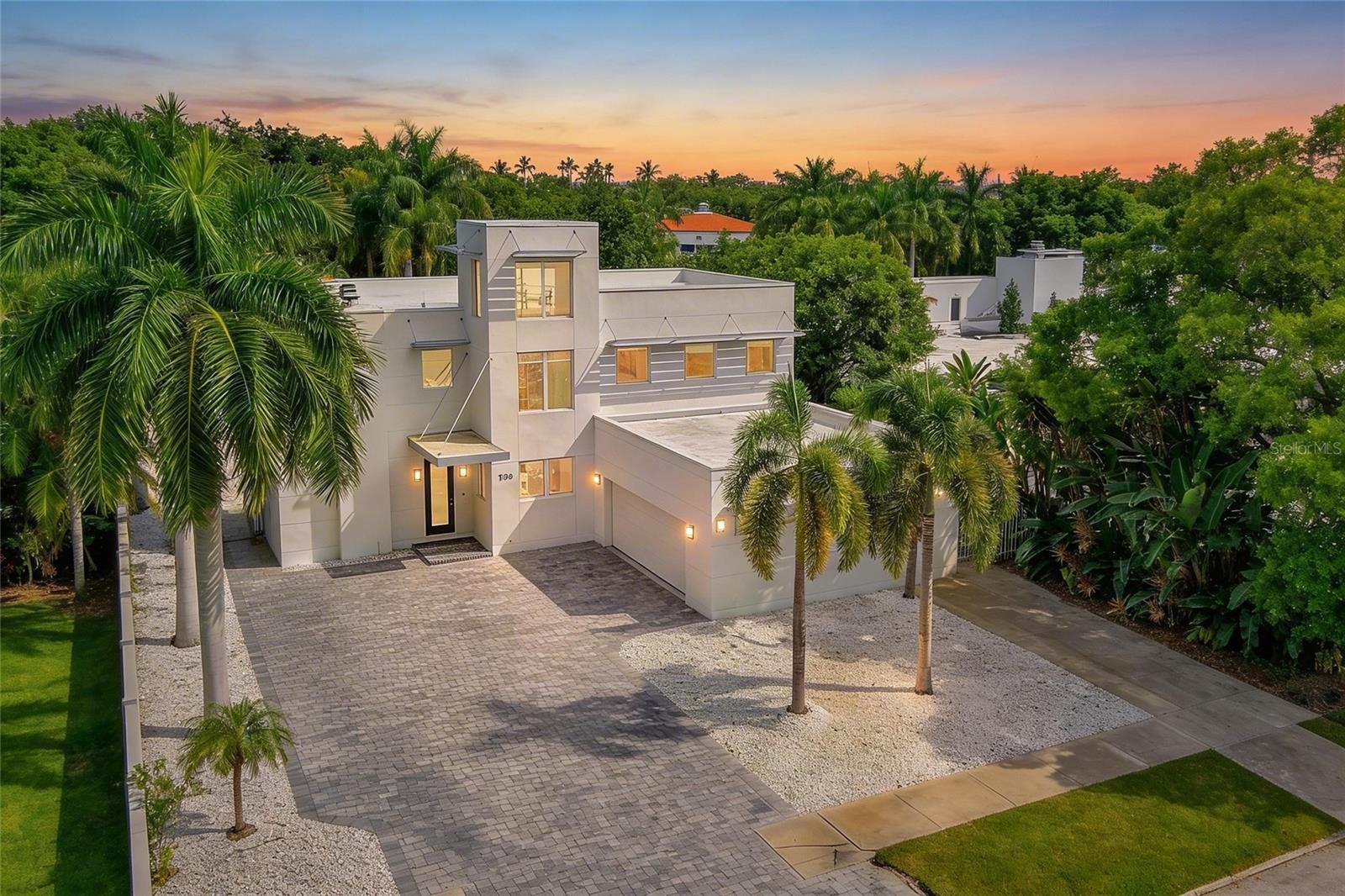 Under contract-accepting backup offers. Step into a home that feels more like a private gallery and retreat than a traditional residence—where modern design, light, and location come together in a way that’s nearly impossible to replicate in Sarasota.

Located just one block from Southside Village and minutes to downtown, this West of Trail architectural residence is designed for the cosmopolitan buyer—someone who values design, art, walkability, and a lifestyle that blends indoor and outdoor living seamlessly.

From the moment you enter, you’re greeted by a dramatic two-story great room with soaring ceilings, polished concrete floors, and a striking mid-century modern fireplace. A wall of glass draws your eye straight through to the sun-drenched, Palm Springs-inspired pool and lush tropical backdrop—creating that immediate “this is different” feeling. The scale and clean lines offer the perfect canvas for an art collector, with expansive walls that invite statement pieces.

The kitchen is both functional and beautifully integrated—designed for someone who entertains without wanting to be separated from the experience. Custom cabinetry, a professional-grade 48" Jenn-Air gas range, double ovens, and a wet bar all open directly to the living and dining spaces, including a character-rich built-in banquet booth that feels both classic and intentional.

On the main level, a guest suite with large sliders opens to a covered, screened lanai—ideal for outdoor dining or evening lounging without interruption. There’s also a dedicated office for the not-quite-retired, a bright and airy laundry room, and thoughtful storage throughout.

Upstairs, the home continues to surprise. A lofted lounge creates separation for guests or quiet moments, while a spacious ensuite bedroom provides comfort and privacy. Then, a true conversation piece—the observatory, accessed via a winding staircase—offers a unique escape that feels both playful and sophisticated.

The primary suite is expansive and light-filled, with generous closet space, dressing areas, and a bathroom that carries through the home’s mid-century modern aesthetic.

Outdoors, the experience is equally refined. Low-maintenance designer rock beds are complemented by mature palms and lush landscaping, framing a private resort-style pool and spa. A detached 400 sq. ft. studio/guest house adds flexibility—perfect as an art studio, fitness space, guest suite, or private office with its own entrance.

The garage is oversized with a two-car door but space for much more—cars, e-bikes, paddleboards, even a golf cart—supporting an active, coastal lifestyle.

This is not a home for everyone—and that’s exactly the point.

It’s for the buyer who has outgrown the ordinary, who appreciates architecture and design, who wants to be close to everything yet live in one of Sarasota’s most desirable residential neighborhoods.

Because the reality is—homes like this rarely come available. And when they do, they don’t last.

If you’ve been waiting for something that actually feels different… this is it.