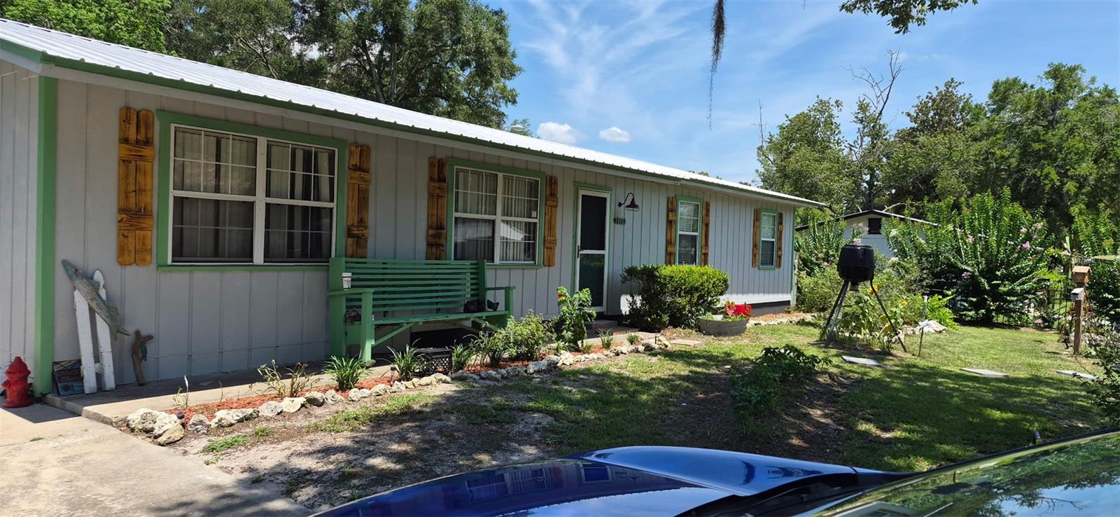 Virtually Staged. Opportunity Knocks in the Heart of High Springs!
Bring your vision and creativity to this 3-bedroom, 2-bath home located on a quiet dead-end street just minutes from the heart of historic downtown High Springs. Whether you're looking for your next home, an investment property, or a renovation project, this property is full of potential and ready for its next chapter.
Situated on a spacious lot with mature landscaping, this home offers a peaceful setting with plenty of room to create your own outdoor oasis. Imagine planting a vegetable garden, adding colorful flower beds, or simply enjoying the shade of established trees while relaxing in your backyard. A storage building provides extra space for tools, lawn equipment, or hobby projects.
Inside, the open floor plan offers a welcoming layout with great flow between the living, dining, and kitchen areas, creating the perfect blank canvas for modern updates and personal touches. While the home could benefit from a refresh, it presents an outstanding opportunity to customize the space to fit your style and needs.
A durable metal roof provides added peace of mind, allowing you to focus your attention on transforming the interior into the home you've always envisioned.
Location is one of this property's greatest features. Enjoy the convenience of being just minutes from quaint, walkable downtown High Springs, where you'll find locally owned restaurants, charming boutiques, an ice cream and coffee shop plus community events that give this small town its welcoming character. Spend weekends exploring the nearby world-famous springs, rivers, and outdoor recreation that make High Springs one of North Central Florida's most desirable places to call home.
Whether you're searching for your first home, a weekend getaway, or your next investment opportunity, this property offers the perfect combination of location, potential, and value. With a little imagination and some updating, this could become the home you've been dreaming about.
Don't miss your chance to make this High Springs gem your own—schedule your private showing today!