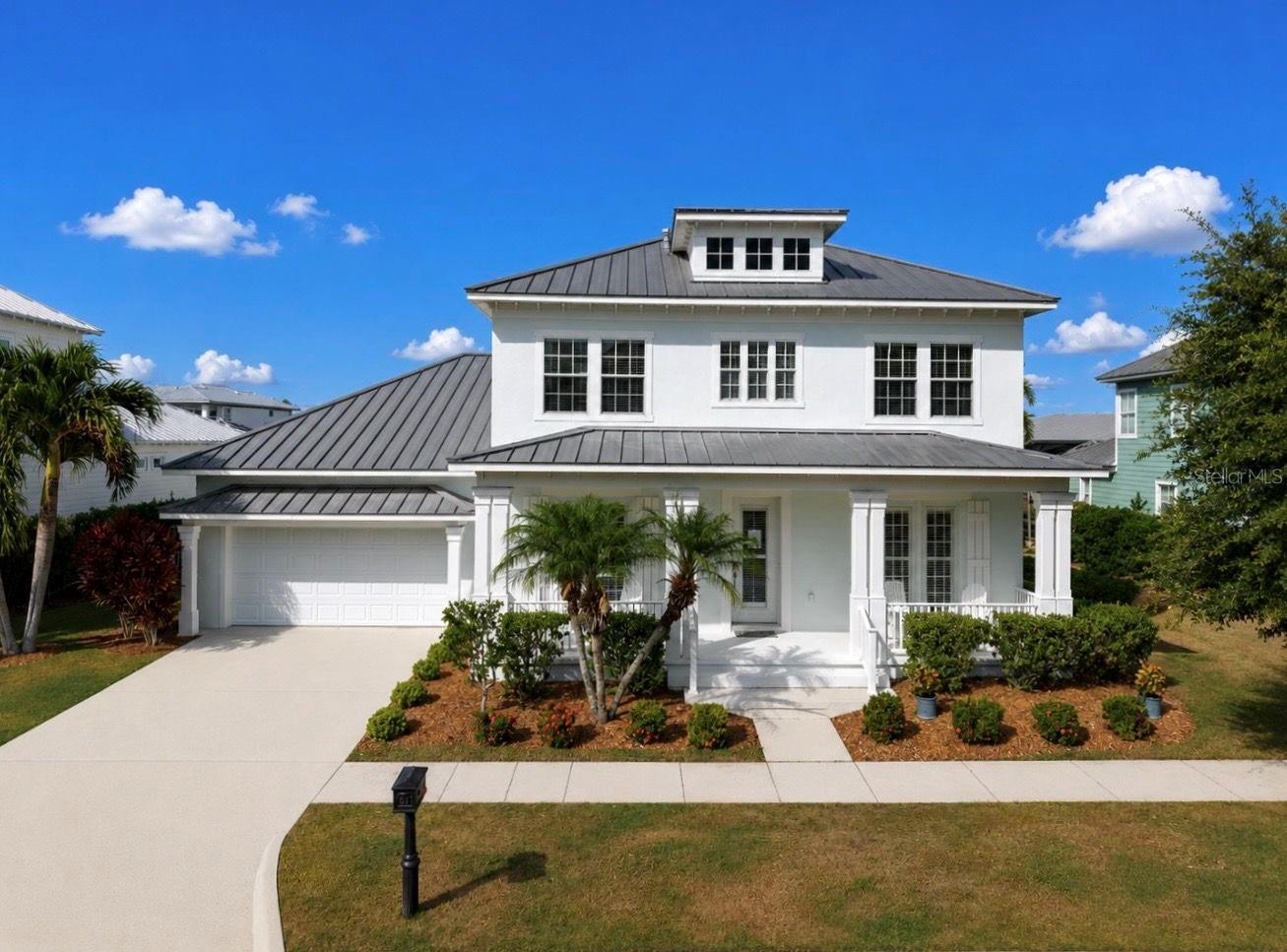 Luxury Coastal Waterfront Home! Experience elevated coastal living in this stunning waterfront residence featuring a private dock with a 13,000 lb boat lift and direct access to beautiful Tampa Bay - perfect for boating enthusiasts and sunset cruises. Designed with a bright, airy coastal aesthetic, this exceptional two-story home offers soaring ceilings, abundant natural light, and an effortless indoor-outdoor lifestyle. This 3548 square foot home offers 4 spacious bedrooms, 3.5 bathrooms, a private office, and a formal dining room. The thoughtfully designed floor plan blends elegance with everyday comfort. Rich bamboo wood flooring flows throughout the home, while expansive living spaces and a versatile loft area provide room to relax, entertain, or gather. The luxurious primary suite is a private retreat featuring an oversized walk-in closet and a spa-inspired bath with an impressive walk-in shower. The chef's kitchen is appointed with stainless steel appliances, generous prep space, and seamless flow into the main living areas. Step outside to the expansive covered lanai overlooking tranquil water views, creating the perfect backdrop for morning coffee or evening entertaining. Completing the home is a spacious 3-car tandem garage and the rare convenience of true waterfront living with quick bay access. This extraordinary coastal home offers the ideal balance of luxury, comfort, and boating lifestyle.
