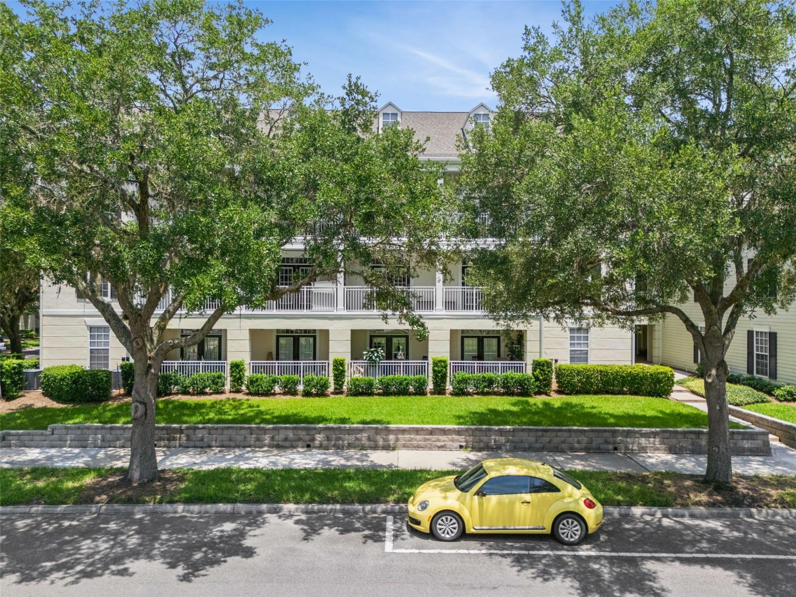 Welcome to Georgetown at Celebration, where tree-lined streets, timeless architecture, and an exceptional lifestyle come together in one of Central Florida's most sought-after communities. This beautifully updated 3-bedroom, 2-bath condominium offers the perfect blend of comfort, style, and convenience, just minutes from Downtown Celebration. Inside, you'll find luxury vinyl flooring throughout, an open and inviting floor plan, and an oversized private balcony accessible from both the living room and a secondary bedroom, creating the perfect space to relax and enjoy Florida living. The renovated kitchen features new granite countertops, new upper cabinets, painted lower cabinets, a lowered counter-height breakfast bar, and modifications to accommodate a full-size refrigerator and microwave. An under-sink water filtration system adds everyday convenience. Both bathrooms offer dual vanities, with one featuring a soaking tub and the other a walk-in shower. A unique hidden flex room tucked behind a custom bookcase door provides the perfect home office, study, or hobby space with built-in cabinetry and a desk. California Closets have been installed in every bedroom, while the primary suite also features a sliding mirrored closet door for added functionality. Numerous updates provide peace of mind, including a new water heater, energy-efficient windows, new toilets, sinks, blinds, low-profile LED lighting, updated smoke detectors, added lighting in the front closet and utility room, improved closet layouts, an updated main water shutoff valve, and valet trash service right at your front door. Most renovations were completed in 2023, with the windows, toilets, and blinds replaced within the past year. Conveniently located just steps from the elevator, this home is also close to Georgetown's outstanding amenities, including a resort-style pool, clubhouse, fitness center, tennis court, playground, grilling area, car wash, and electric vehicle charging stations. As a Celebration resident, you'll enjoy over 26 miles of walking and biking trails, multiple community pools, parks, playgrounds, dog parks, athletic fields, and year-round community events. Downtown Celebration offers charming boutiques, restaurants, cafés, banks, salons, and the popular Sunday Farmers Market, creating a vibrant small-town atmosphere unlike anywhere else. Ideally located with quick access to I-4, SR-417, and US-192, you're just minutes from Walt Disney World Resort, Disney Springs, Orlando International Airport, and countless shopping, dining, and entertainment destinations. Whether you're looking for a primary residence, seasonal home, or investment property, this move-in-ready condominium is an exceptional opportunity to experience the Celebration lifestyle.