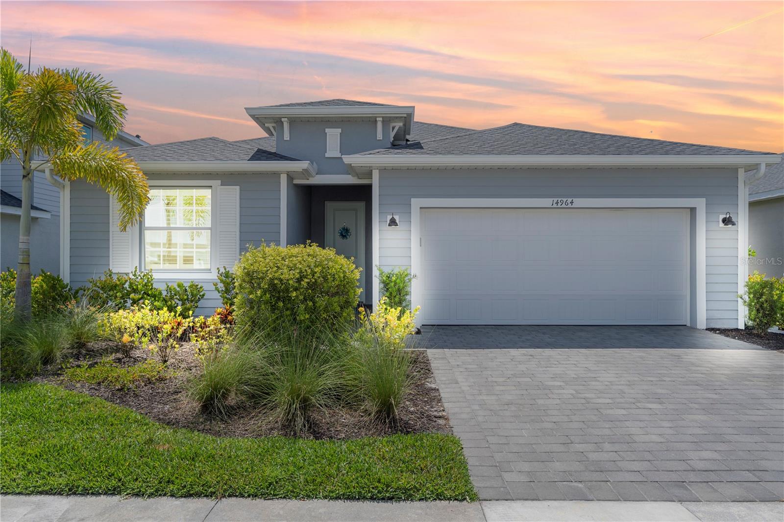 Welcome to your dream home ARECA MODEL in the highly sought-after Tuckers Cove at Babcock Ranch—where luxury, comfort, and lifestyle come together beautifully. With over $40,000 in upgrades and just moments from the iconic Pirate Ship Restaurant, resort-style pool & lazy river, splash park, Luau-style beach, Fitness center, pickleball courts & sports courts, basketball, dog park, mail center, and all the incredible amenities Tuckers Cove is known for, this home offers the ultimate Florida living experience. Step inside this beautiful home and immediately notice the attention to detail—features NO CARPET ANYWHERE, with stunning wood plank tile flooring throughout. The elegant foyer welcomes you with a built-in-glass & mirror shelves setting the tone for the custom craftsmanship found throughout the home. From the beautiful Sanibel plantation shutter window coverings on every window, complemented by designer lighting, chandeliers and tray ceilings, every space has been thoughtfully designed. The heart of the home is the gourmet kitchen, showcasing quartz countertops, NEW Samsung Refrigerator with craft ice, a large island with an oversized sink facing the pool and lake. Walk in large pantry, gas stove, enjoy above and below cabinet lighting creating the perfect ambiance for any occasion. Three expansive sliding glass doors flood the space with natural light that connects indoor and outdoor living space with the sliding glass doors featuring a blackout electric remote-control blind for added convenience and privacy. The primary bathroom has a custom shower bench, bidet, and a large electric mirror with multiple lighting settings and a defogging feature. Additional upgrades include an air purifier integrated into the AC system, whole-home surge protector, epoxy garage floors, garage refrigerator, and laundry room cabinetry above both the sink and washer/dryer for extra storage and organization. Outdoor living is truly spectacular with a HEATED POOL AND SPA, and serene lake views and UPGRADED HANDRAILS, color-changing lanai cage lighting, can lights on the back porch, lanai fan, and interior wall-mounted pool light controls. The backyard palm trees are illuminated with uplighting and wrapped white accent lights creating a stunning evening ambiance. All pavers have also been professionally sealed. Technology and convenience with 4 mounted TVs included, Euro WiFi extenders, Caseta switches. ALL FURNITURE IN ENTIRE HOME AND ALL DECOR IS NEGOTIABLE. Additional highlights include:HURRICANE IMPACT GLASS throughout the entire home, Epoxy-coated garage floors and garage refrigerator, Laundry room with cabinetry, and a sink. The upgrade list for this home is too extensive to list. Enjoy living in Babcock Ranch, America's first entirely solar-powered town, with access to multiple community pools, nature trails, with shopping and dining. Come enjoy the convenience living with festivals, farmer's markets, Concerts, Health gym and just a golf cart ride to the grocery store. There is so much to do with hundreds of clubs and activities planned every month. There is a K-12 neighborhood school with a brand new sports complex, including football, soccer and baseball fields. There are many playgrounds and parks, including multiple dog parks and a brand new skate park and six new parks along the nature trails.  Beautiful parks and amenities let you experience SW Florida at its finest! Come live a better life at Babcock Ranch!