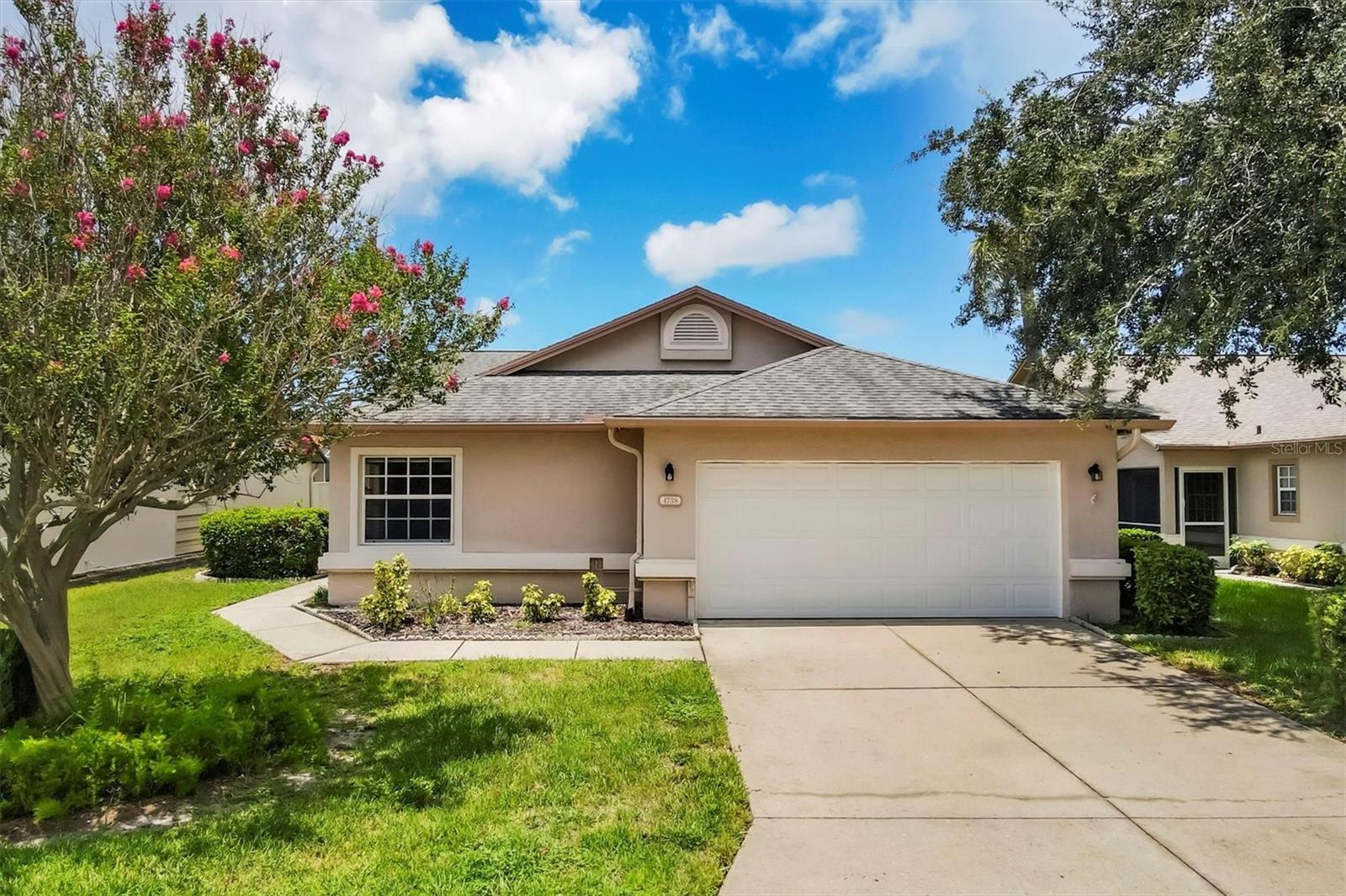 Don't miss your chance at this spacious 1,866 sq ft residence nestled within the highly desirable Peridia Golf & Country Club community. This 2-bedroom, 2-bathroom home features a versatile den/bonus room and an open floor plan designed for comfortable living and effortless entertaining. The dining area seamlessly connects to the living room and bonus space, perfect for hosting gatherings.

Bright and inviting, the unit boasts new window treatments and abundant natural light. Expand your living space by opening the sliding glass door to the enclosed patio, or enjoy outdoor grilling on the second patio. Additional highlights include a two-car garage, an eat-in kitchen with ample cabinetry, and convenient access to cable, internet, and lawn maintenance—all included in the HOA fees. Importantly, there are no CDD fees.

As part of the community, residents enjoy a golf membership that grants access to tennis, pickleball, a clubhouse for social events, a heated pool, and a tiki bar. The location offers easy proximity to shopping, dining, beautiful sandy beaches, and airports, making this an ideal place to call home.
* SELLER TO PROVIDE/GIVE CREDIT FOR A BRAND NEW ROOF WITH AN EXECUTED CONTRACT!