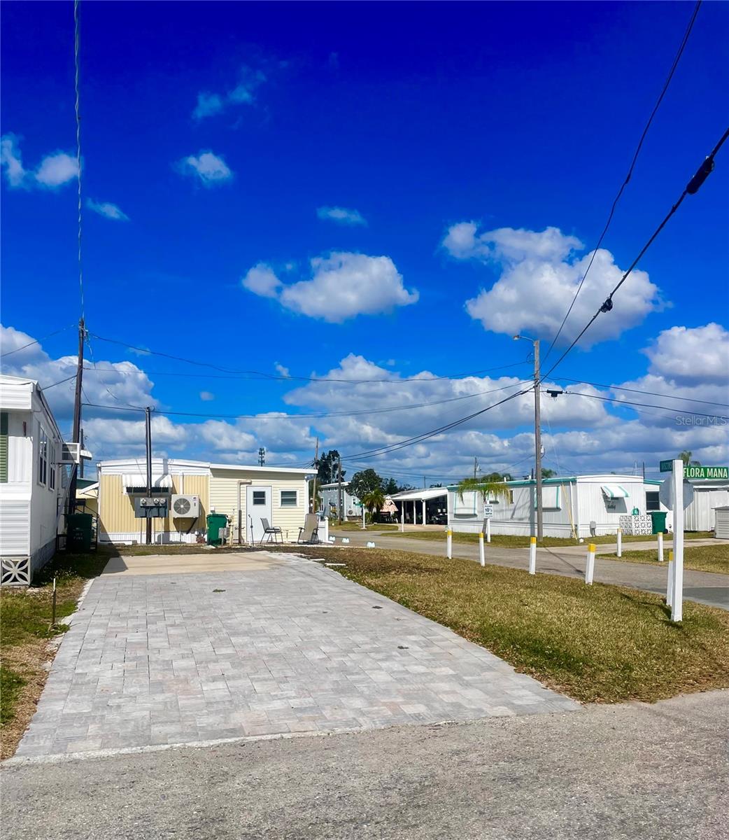 Welcome to lovely Jet Park! This a beautiful corner lot with upgraded paver driveway and a front partial view of the Manatee River. Jet Park is a great low key, 55+ park and a very active community located in a great central location of Palmetto. Close to shopping, restaurants, groceries and many major thoroughfares.  Low monthly fees of only $195 a month.  Bring your RV, trailer, 5th wheel to Florida whenever you want! Sites will also accommodate a mobile home or park model. Jet Park has a boat ramp for the residents which gives you direct access to the Gulf of America.  There is also a picnic area with fire pit, kayak launch, shuffleboard, pool, full clubhouse with kitchen. Lot size is 64 x 28