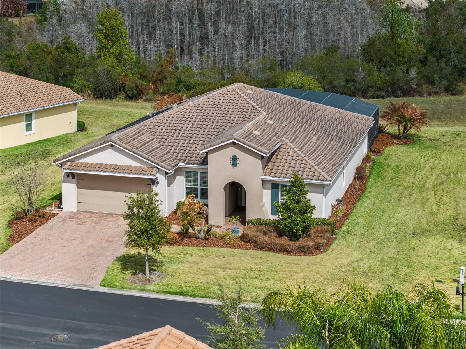 ONE OF THE MOST STUNNING & PRIVATE **POOL** HOMES IN ALL OF SOLIVITA! Welcome to this exceptional Sorano model in Portofino Estates offering 4 Bedrooms PLUS Den/Sunny Flex Room, 3 Full Baths, and one of the most impressive outdoor living spaces in the community. Situated on an oversized lot with private conservation views and northeast rear exposure, this home delivers luxury, privacy, and peace of mind. The moment you walk through the front door, your eyes are immediately drawn to the gorgeous resort-style saltwater pool with water feature, perfectly framed by serene conservation views. With 12’ ceilings in the living room and 8’ glass sliders, and expansive rear windows, natural light pours in while showcasing your private outdoor oasis from nearly every rear window in the home. The outdoor space is truly extraordinary - featuring an extended covered lanai, solar-heated saltwater pool (with solar panels and blanket), generous seating areas, and exceptional privacy. This is Florida living at its finest. Inside, you’ll find brand-new LVP flooring throughout the main living areas, crown molding, volume ceilings, rounded corners, plantation shutters, and custom finishes throughout. The home has been freshly painted (2020), creating a bright and modern feel. The gourmet kitchen is beautifully appointed with: Granite countertops, Cooktop & double ovens, Glass door walk-in pantry, Large pull-out storage drawers,  Brand-new backsplash (2021), & New under-cabinet lighting (2021). The spacious primary suite is a true retreat featuring upgraded quartz vanities, large tiled shower, and a custom California Closet with luxury shelving (2021) for elevated organization and storage. Additional recent upgrades include: HVAC with UV light system (2024), Thermostat (2024), Interior paint (2020), & gorgeous Epoxy-coated garage flooring. **For added buyer confidence, the sellers recently completed a full home inspection with all minor repairs addressed, allowing the next owner to move in completely worry-free.** Located in award-winning Solivita! Solivita offers endless amenities including 14 heated swimming pools, indoor pool and indoor walking track, state of the art fitness centers, 17 pickleball courts, lighted tennis courts, two 18-hole Championship golf courses, over 250+ clubs to join, 3 community restaurants, Farmers Markets every Monday and Friday, and so much more! Only 30 minutes from Disney and all of Orlando’s major attractions. Publix, Aldi’s & Super Walmart are also just a few miles outside the Main Gate. Convenient to shopping and major roadways. Poinciana Lakes Plaza is a MAJOR NEW SHOPPING CENTER that features so many restaurants and shopping including: Sprouts Grocery, Ross, TJ Maxx, ULTA Beauty, Hair Cuttery, Burlington, Rack Room Shoes, Petco, Outback, 5 Guys, First Watch, Urgent Care, Dentist, TD Bank – and so much more. If you’ve been waiting for a private, move-in-ready, luxury POOL home that truly stands out – THIS IS IT!