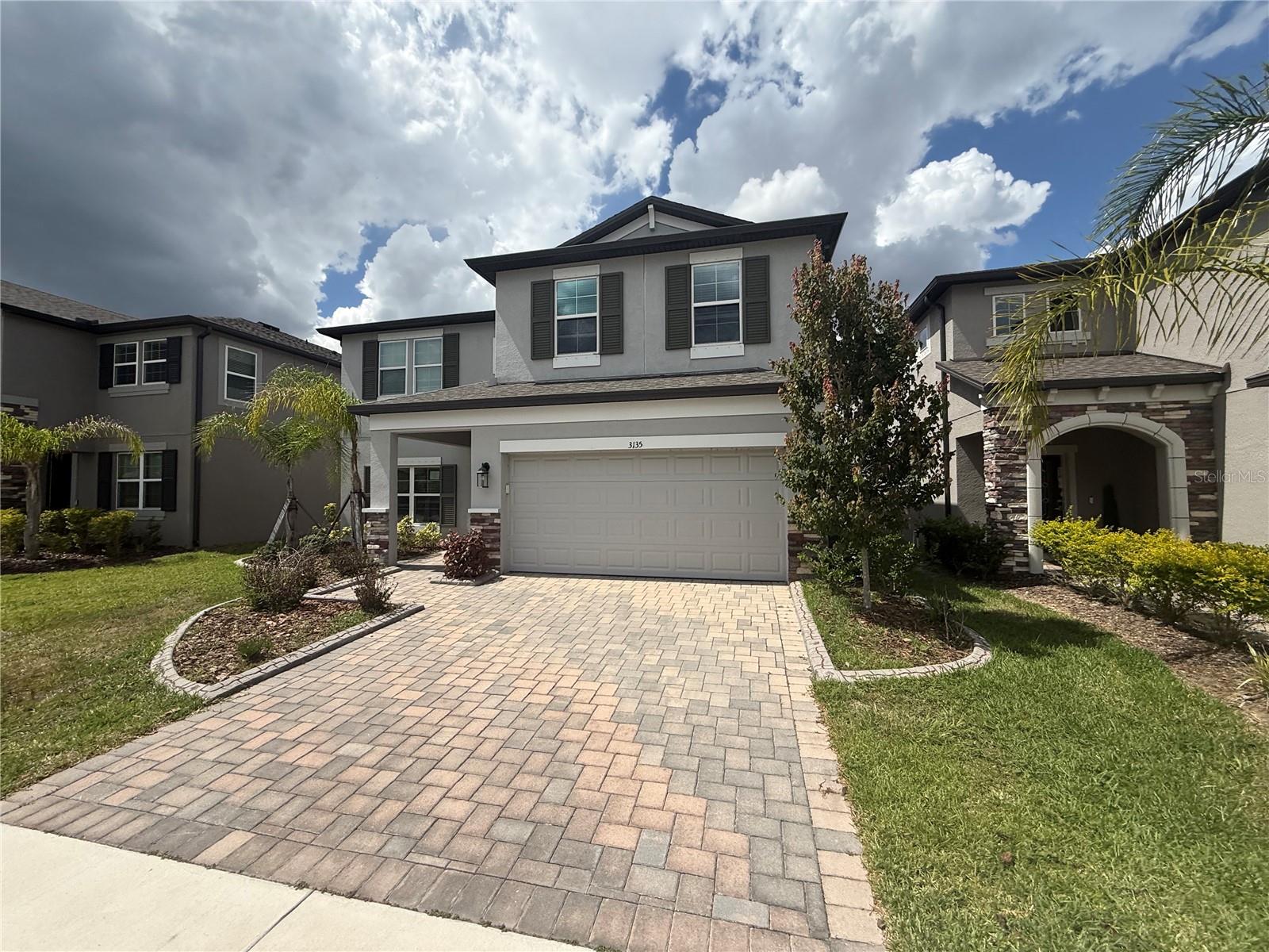 Welcome to Berry Bay with a water view!  Beautiful 2 story home and superb opportunity!  5 bedrooms and 3 bathrooms with over 3300 square feet!  Spacious formal living and dining rooms greet at the entrance from the brick pavered driveway.  Downstairs features beautiful tile flooring and a fantastic kitchen with granite and walk in pantry.  Center bar is central to the family room and casual dining space - all with views of the large back yard, open patio and quiet pond.  Upstairs opens to a loft perfect for family gatherings.  The primary suite offers walk in closets and double vanity, glass shower and tub.  Secondary beds are upstairs too and share a full sized bath.  Downstairs is one of the seocndary bedrooms as well - perfect for guest situation.  It's good to be home! This property may qualify for Seller Financing (Vendee).