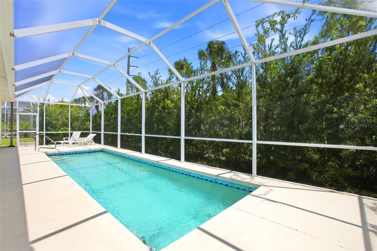 Experience the country club lifestyle without the hefty HOA fees in this stunning 3-bedroom, 2-bath pool home located in the beautiful community of River Place!

Step outside to your private backyard oasis featuring a heated pool, spacious lounge area, and dedicated space for BBQ entertaining—with plenty of room to add an outdoor kitchen. Inside, you’ll immediately appreciate the open floor plan, soaring volume ceilings, and thoughtful attention to detail throughout. Elegant diagonal tile flooring flows seamlessly through the home, creating a bright and sophisticated feel.

The spacious laundry room, conveniently located off the kitchen, provides direct access to the three-car garage. Additional features including a tile roof and hurricane shutters offer both style and peace of mind.

The primary suite is a true retreat, complete with an impressive walk-in closet and a luxurious en-suite bath featuring dual vanities, a garden soaking tub, walk-in shower, and private access to the pool area.

The kitchen is designed for both everyday living and entertaining, offering abundant counter space, ample cabinetry, and stainless steel appliances. Large sliding glass doors open the main living areas to the lanai and pool, creating the perfect indoor-outdoor Florida lifestyle.

Residents of this maintenance-free community enjoy exceptional amenities including a clubhouse, fitness center, resort-style pool, playground, and kayak/small boat launch with access to the Braden River. Ideally located just minutes from I-75, downtown Lakewood Ranch, and the shopping and dining destinations at UTC, with golf and tennis nearby, this home truly offers the very best of Florida living!