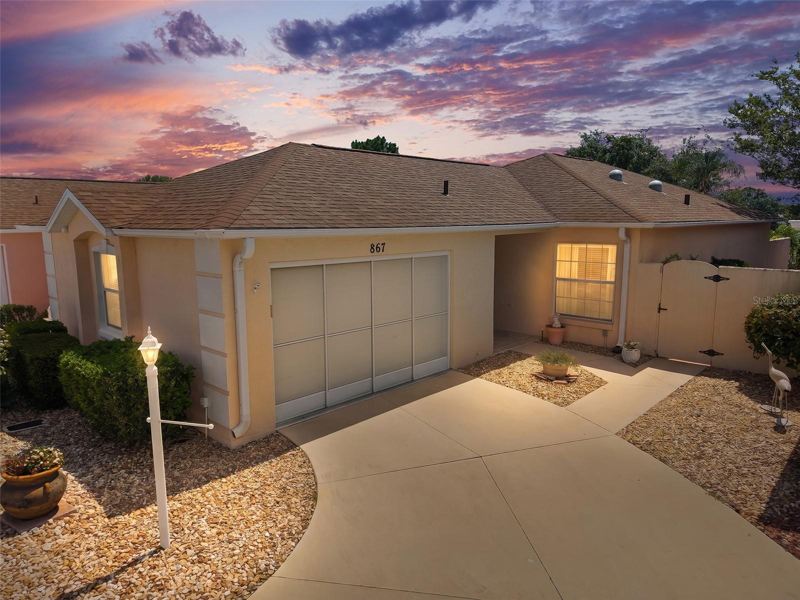 • TURNKEY Furnished Las Brisas Courtyard Villa | 2 Bedrooms | 2 Bathrooms | Stucco & Concrete Construction
• Enclosed Climate-Controlled Lanai + Oversized Birdcage with Turtle Preserve Views | Golf Cart Included *Roof 2015 * HVAC 2016 * New Water Heater * NO BOND * Termite Bond Paid 4/26

Experience the perfect blend of privacy, comfort, and low-maintenance living in this beautifully updated turnkey Las Brisas courtyard villa. Constructed with durable stucco and concrete construction, this move-in-ready home offers a sought-after combination of indoor and outdoor living spaces designed for enjoying The Villages lifestyle.

Step inside to discover an inviting open floor plan featuring light-colored updated cabinetry, granite countertops throughout, and tasteful furnishings, décor, and homewares included. The well-appointed kitchen is designed for both everyday living and entertaining, offering stainless steel appliances, pantry storage, convenient pull-out shelving, and elegant upper and lower cabinet accent lighting. Newer kitchen appliances include the refrigerator, range, and oven, replaced in 2022.

The spacious primary suite serves as a private retreat, highlighted by an updated en-suite bathroom featuring a beautifully tiled walk-in shower with seamless glass doors. A spacious walk-n closet provides ample storage, including a small safe for valuables.  A comfortable guest bedroom and second bathroom provide ideal accommodations for visiting family and friends.

One of the home's most desirable features is the enclosed, air-conditioned lanai that adds valuable year-round living space. Beyond the lanai, the oversized birdcage situated NorthEast Orientation creates the perfect setting for morning coffee, outdoor dining, or relaxing while enjoying peaceful views of the turtle preserve and decorative fountains. Minimalist landscaping keeps maintenance simple, allowing more time to enjoy the Florida sunshine.

Additional updates and features include a roof replaced in 2015, HVAC system replaced in 2016, brand-new water heater, termite bond renewed in April 2026, and a finished garage complete with tile flooring, multiple built-in storage areas and includes an insulated garage door.

For added convenience, the sale includes a 2016 golf cart equipped with newer lithium batteries (approximately two years old). Whether you're seeking a full-time residence, seasonal getaway, or investment opportunity, this beautifully maintained turnkey villa offers exceptional value, desirable upgrades, and the carefree lifestyle buyers are searching for.