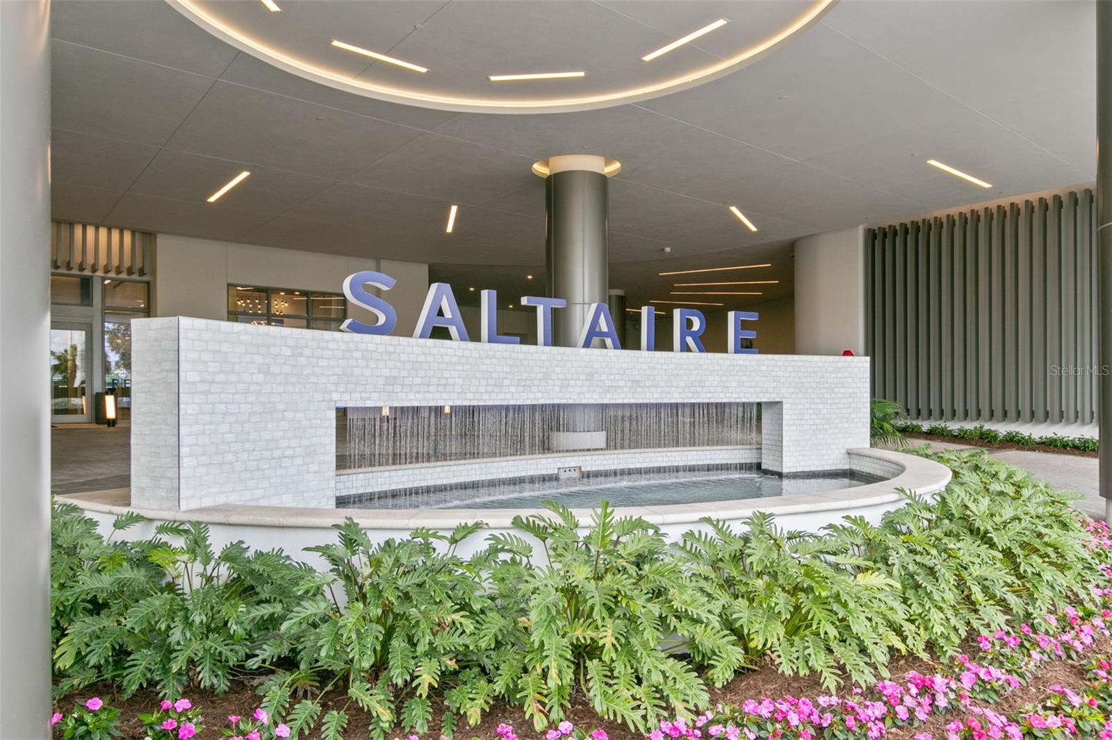 One of the few units in this building in this price range. Fully furnished(optional) corner condo on 12th floor in beautiful modern
building of Saltaire in vibrant St Pete downtown. Owner has not lived in it but used it as second home visited once every few months. It  has never been rented. Short walk to restaurants, museums,Rowdy stadium and pier. Secure building with 24 hour concierge. fab entry to building as well as parking. New construction with all safety features for hurricanes, hurricane glass in all units and common areas, no damage to building from past 2 hurricanes. Unit has an Open floor plan with living/dining/kitchen combo. View of bay from main bedroom and living room and view of city from living room and second bedroom. City views are exceptionally beautiful at night while bay views are soothing during day. Master bedroom has fully built walk in closets, his and hers. Second bedroom has a walk in closet as well. Third bedroom has a built in closet. Kitchen has paneled refrigerator, induction cooktop, island with quartz countertops and waterfall feature. Automated Window treatment with opaque light blocking shades in both bedrooms and translucent shades in living room. Two bedrooms have ceiling fans as well. Buyer has an option to buy it fully furnished. Very slightly used furniture as owner never lived here. Swimming pool on 7th floor with amazing views, cabanas, outdoor grills. State of the art gym, news cafe and social area which can be reserved for up to 50 guests. There are lot of social activities in the building, like yoga classes, book club and get togethers. Saltaire is a beautiful building with high class construction and reasonably priced.