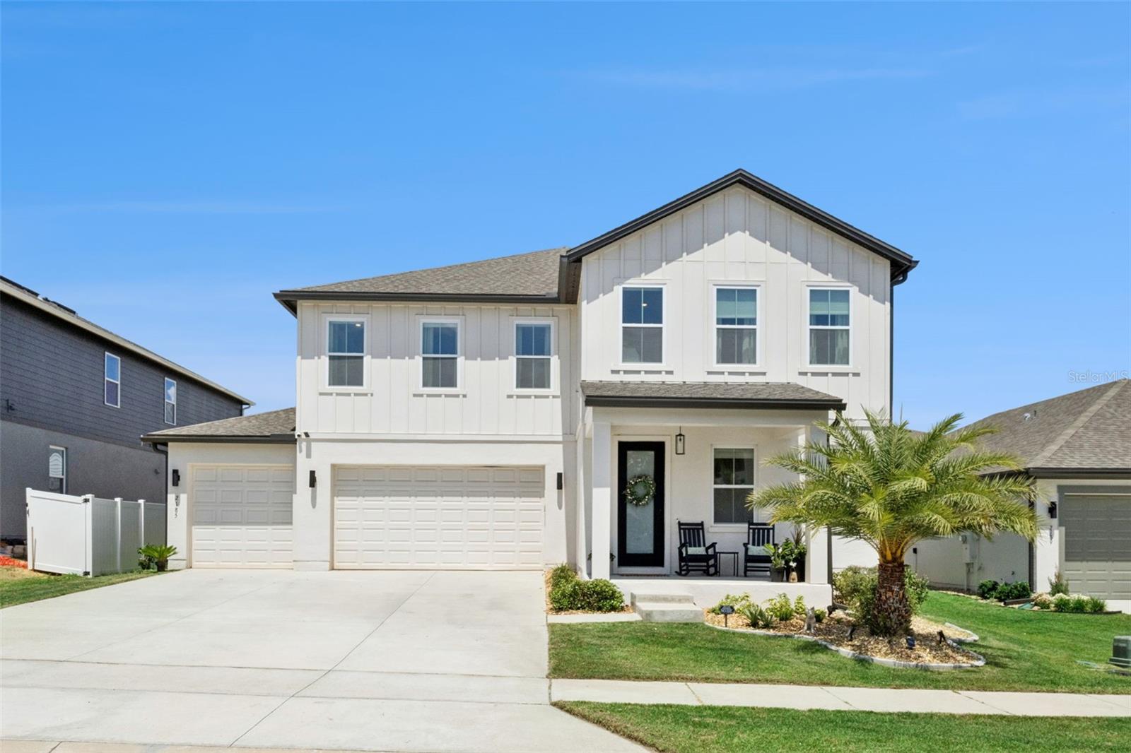 Some homes are built. This one was designed — and you can feel the difference the moment you walk in.
Built in 2023 by Ashton Woods — the premier builder within The Hills of Minneola — this 4-bedroom, 3.5-bath home brings together luxury finishes and thoughtful design in one of the area's most coveted communities, with 3,144 sq ft of space that feels as considered as it is livable.
The two-story great room sets the tone: a floor-to-ceiling fireplace accent wall flanked by custom built-ins, thoughtfully placed custom wainscoting and millwork that add a layer of refinement that carries throughout the home — the kind of detail that separates a truly designed home from one that's simply finished. Designer craftsmanship rarely seen in new construction is evident in every corner.
The kitchen is built for both function and entertaining — quartz countertops, a marble backsplash, and an oversized stainless farmhouse sink anchor a space that handles everything from a quiet weeknight dinner to a full house. A dedicated butler's pantry keeps the prep work out of sight, and a first-floor office keeps work life contained without disconnecting you from the rest of the home.
Upstairs, the primary suite offers a genuine retreat: a private fireplace, a spa-style bathroom with an oversized dual-head shower, dual-sink vanity, and a custom shelving closet that goes well beyond the standard builder package. A dedicated upstairs laundry room keeps daily life running quietly in the background.
The three additional bedrooms give the home real flexibility — a second bedroom with its own en suite is ideal for guests or multi-generational living, while the other two adapt easily to whatever your household needs.
Outside, the 7,200 sq ft lot offers privacy with a fully fenced in backyard, security, and space to breathe — ideal for effortless outdoor living. A three-car garage with a dedicated workshop and rain gutters round out the exterior. And for those who appreciate the details that truly matter, upgraded spray foam insulation on all exterior walls delivers superior energy efficiency and year-round comfort well beyond standard builder spec. 4 bedrooms, 3.5 baths, a first-floor office, 3,144 sq ft, a 3-car garage, resort amenities, and a top-rated school district — with a brand-new school right in the community and access to some of the region's best charter schools just minutes away. New construction quality, already move-in ready. Come see it for yourself.