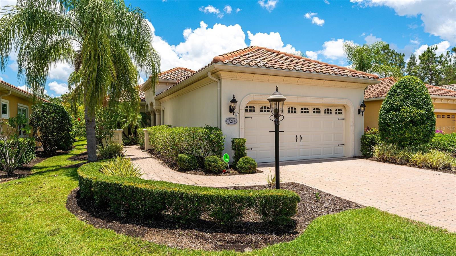 Introducing 7214 Belleisle Glen, a captivating residence located in the Country Club East community of Lakewood Ranch. This immaculate property represents the epitome of luxury living, offering an exquisite blend of elegance, comfort, and modern design. Boasting exceptional craftsmanship and a wealth of amenities, this home presents an unparalleled opportunity for those seeking the perfect blend of sophistication and tranquility.  As you approach this stunning property, you'll be greeted by a beautifully landscaped front yard and an inviting façade that exudes charm and curb appeal. Step through the grand entrance and be prepared to be captivated by the sheer beauty of this remarkable residence.  The interior of this home is a true masterpiece, featuring high ceilings, expansive windows, and a well-thought-out floor plan that maximizes both space and natural light. The spacious living area offers a seamless flow, ideal for hosting unforgettable gatherings or simply relaxing in the comfort of your own sanctuary.
The kitchen is a chef's dream, featuring stainless steel appliances, custom cabinetry, a large center island, and an abundance of counter space. Whether you're preparing a casual meal for your loved ones or indulging in a culinary adventure, this kitchen is sure to inspire your inner chef.  The master suite is a sanctuary of tranquility, providing a peaceful retreat at the end of a long day. With its generous proportions, a luxurious en-suite bathroom, and a walk-in closet, this private oasis is designed to indulge your senses and ensure a restful night's sleep.  In addition to the master suite, this remarkable residence offers several well-appointed bedrooms, each with its own unique charm and ample closet space. These rooms can easily be transformed into guest suites, home offices, or hobby rooms, accommodating your lifestyle needs effortlessly.  Venture outdoors to the spacious screened in back porch where you'll find a private oasis perfect for entertaining or unwinding. This outdoor space is designed for creating unforgettable memories with family and friends.
Situated in the coveted Country Club East of Lakewood Ranch community, residents of 7214 Belleisle Glen enjoy access to an array of world-class amenities. From championship golf courses and exclusive country clubs to picturesque parks and nature trails, there's always something to explore and experience in this vibrant neighborhood.  In addition to its prime location, this home offers convenient access to a wealth of shopping, dining, and entertainment options. With its proximity to major highways and airports, you're just a short drive away from the vibrant city life of Sarasota and the pristine beaches of the Gulf Coast.

Listing is now unfurnished.