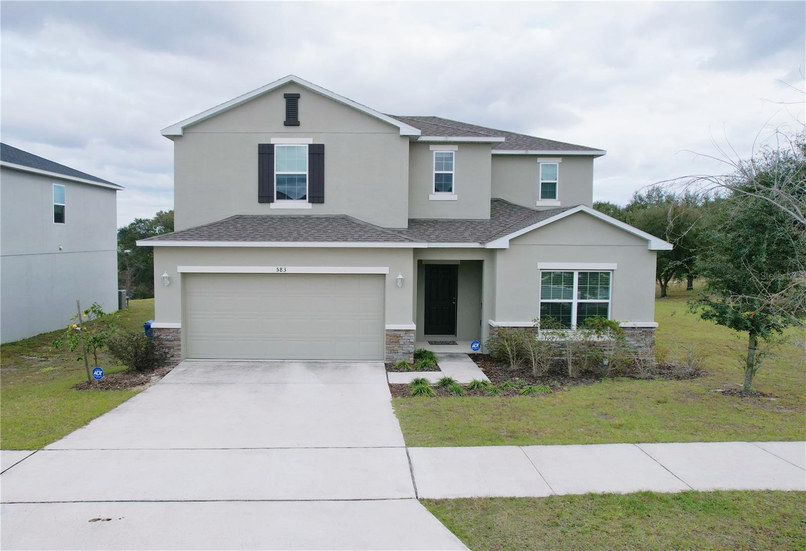 This incredible 5-bedroom, 4-bath corner-lot single-family home is located just 5 minutes from beautiful Lake Minneola. Even better, the property offers extra privacy with no neighbor on one side and no rear neighbors — allowing you to enjoy breathtaking sunrises every morning.
The popular Willow floor plan features an exceptionally open-concept design, perfect for entertaining, with an oversized kitchen island, spacious pantry, and expansive living area. The first floor includes a private guest suite, while upstairs offers a large loft ideal for flexible living, a media room, or play area.
The owner’s retreat boasts generous square footage, a luxurious en-suite bath, and a large walk-in closet. All secondary bedrooms are spacious with ample closet space, making every room equally desirable. A thoughtfully designed bathroom layout with separated double sinks and a private tub/toilet area makes busy mornings much more convenient for the whole family. An additional upstairs bathroom adds even more functionality.
This home has been lightly used over the past few years as a second home for seasonal owners, making it feel exceptionally well maintained and barely lived in.
Conveniently located just 40 minutes from Downtown Orlando and approximately 40 minutes from Walt Disney World, this home offers the perfect balance of comfort, privacy, and accessibility.
Schedule your private showing today before it’s gone!