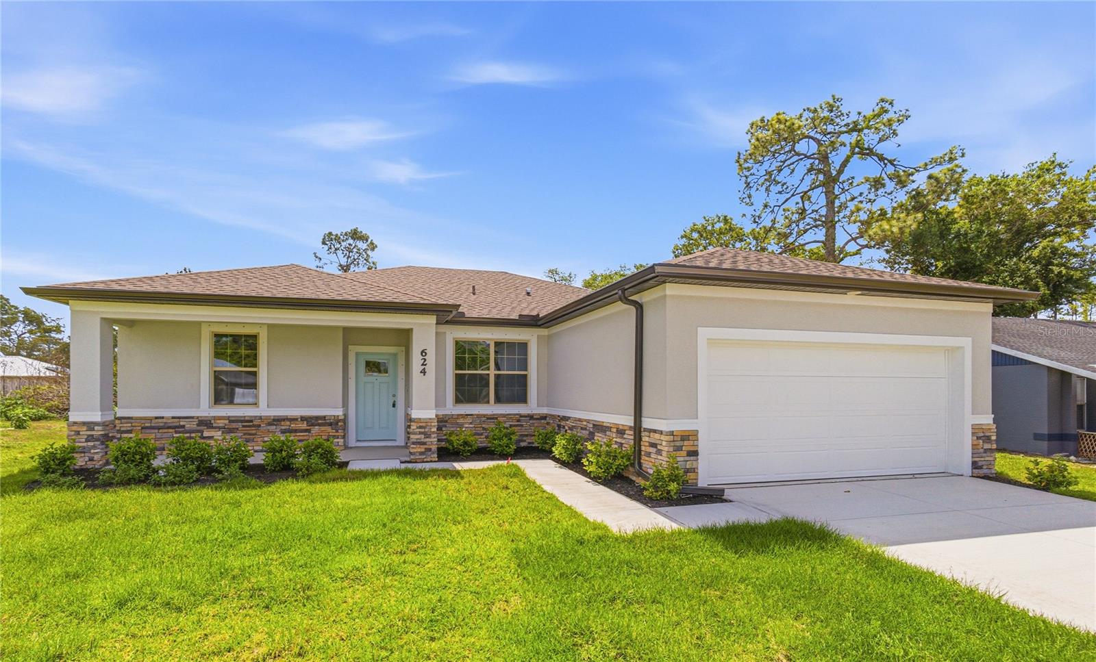 NOW OFFERING 3% TOWARDS CLOSING COSTS WITH PREFERRED LENDER.   Great price with luxury features and ready now! A newly constructed home with city water and septic system in North Port, with no HOA fees!  Great location for quick access to shopping, medical conveniences, parks and schools.  This affordable new home is ready for you and is just what you've been looking for...No HOA and with city water! This home has 9'4" tall ceilings, a nice and open layout with a versatile floor plan. The house features 4 bedrooms, 2 full bathrooms,  dining room, a living room, an open kitchen and a 2-car garage with 1810 square feet of living space. The living space is well-utilized with high ceilings and many windows providing natural light. The interior features will provide you with the quality and luxury you were looking for in your new home. This home has a split floor plan with the primary suite on one side of the home and the guest bedrooms on the other. The primary bedroom has a tray ceiling and large windows that let in natural light. You'll also enjoy a resort-style bathroom with a spacious walk-in shower with floor-to-ceiling tiled walls and a glass enclosure. It also features a linen closet, double vanity and a large walk-in closet. The living room features large windows and several LED fixtures providing plenty of light with access to the covered lanai. The living room is open to the kitchen, where you'll find a huge center island with extra seating for casual dining and plenty of cabinets. The kitchen features stainless steel appliances, Shaker-style cabinets with crown molding, decorative hardware, subway tile backsplash and granite countertops. The dining room is located at the front of the house, with large windows allowing for plenty of natural light. The home includes luxury vinyl plank flooring in the main living areas and bathrooms for durability and comfort. You'll love these floors! They are easy to maintain and offer a modern design, perfect for new homes. Other features include the same beautiful Shaker-style cabinets with hardware and granite countertops in the bathrooms, 5-inch baseboards, a garage door opener, gutters on the exterior, R38 insulation, a 16 SEER HVAC and much more. Visit our model center and compare the features and quality with other homes and you'll see the difference. We make buying easy for you!