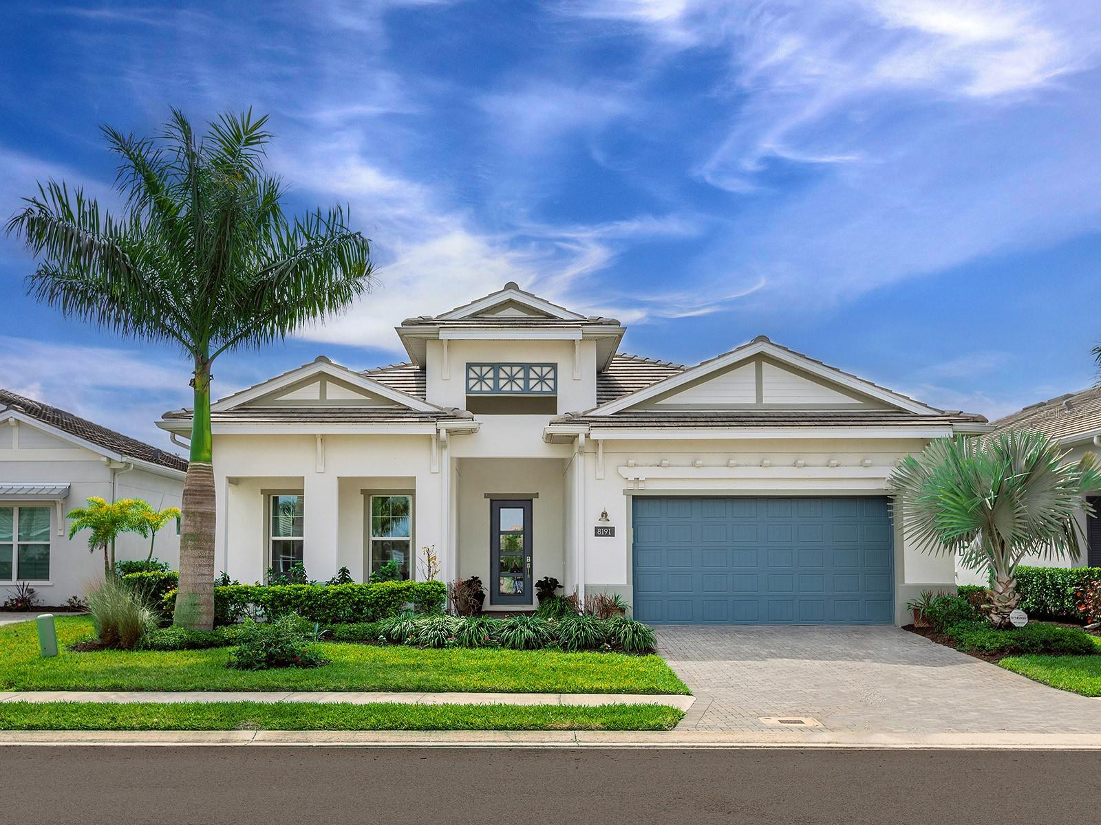 Better than new and extensively upgraded, this 2022 Toll Brothers Carver floorplan offers refined design, elevated finishes, and effortless indoor-outdoor living in the highly desirable Isles at Lakewood Ranch. This beautifully designed home features 3 bedrooms, 3 full baths, a powder bath, and a private office, all set within an open, light-filled layout ideal for both everyday living and entertaining. Wood-look plank tile flooring runs throughout the home, complemented by crown molding, custom trim details, and designer lighting, creating a clean, modern aesthetic. The chef’s kitchen is the centerpiece of the home, showcasing ceiling-height shaker cabinetry, quartz countertops, brushed brass hardware, a walk-in pantry, and a premium KitchenAid appliance package with double wall ovens, a gas cooktop, and an oversized island designed for gathering. A custom-built coffee bar adds a stylish and functional touch. The spacious great room is designed for connection and comfort, featuring surround sound and large sliding glass doors that open to the extended covered lanai, creating a seamless indoor-outdoor living experience. The primary suite is a private retreat with a generous sitting area, oversized walk-in closet, and spa-inspired bath featuring dual vanities, a freestanding soaking tub, and a large walk-in shower with floor-to-ceiling tile. This upgraded bathroom configuration is no longer offered by the builder, making it a rare and highly desirable feature that cannot be replicated within the community. Two additional guest suites with extra storage each include their own en-suite baths, providing privacy for family and visitors, while the dedicated office with French doors offers a quiet and flexible workspace. The covered and screened lanai with built-in speakers provides the perfect setting for relaxing or entertaining, while the spacious backyard offers plenty of room to add the pool of your dreams. Additional highlights include an oversized two-car garage with space for a golf cart or two small cars, smart lighting features throughout, and manicured landscaping. Residents of The Isles enjoy resort-style amenities, including a clubhouse, fitness center, pool, tennis courts, pickleball, basketball, a fishing pond, and a dog park. Ideally located just minutes from Waterside Place, Lakewood Ranch Main Street, UTC shopping and dining, Sarasota Polo Grounds, and the Gulf Coast’s award-winning beaches. A beautifully upgraded home offering modern luxury and the best of the Lakewood Ranch lifestyle.