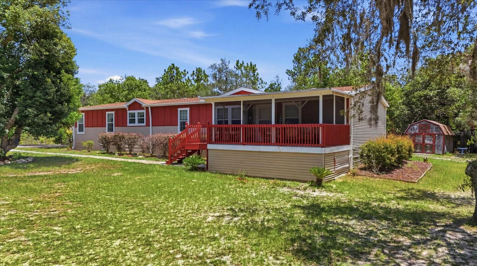 Discover the space and flexibility this charming country home has to offer. Featuring 4 bedrooms, 2 bathrooms, and 2,356 square feet of living space, this home sits on 1.03 fully fenced and gated acres with plenty of room for boats, RVs, pets, additional outbuildings, or future improvements.
A detached carport and two storage sheds provide excellent space for vehicles, tools, and equipment. The fully screened and insulated front porch offers a comfortable place to relax year-round before stepping inside to the spacious great room and open kitchen, complete with all appliances. The home also features a reverse osmosis system for the  well, providing added peace of mind.
The generous primary suite includes a soaking tub positioned beneath a window, creating a relaxing retreat at the end of the day. Nice shower too! Bright living spaces and well-sized bedrooms provide room for family, guests, or a home office.
The backyard offers endless possibilities, with ample space to add a pool, workshop, or outdoor entertaining area. As an added bonus, new flooring plank materials are included and ready for the new owner to install.
Conveniently located near shopping, restaurants, and outdoor recreation, this home is just a short drive from the Homosassa River, Ellie Schiller Homosassa Springs Wildlife State Park, Crystal River, and Rainbow River, offering easy access to boating, fishing, kayaking, swimming, and the best of Florida's Nature Coast.