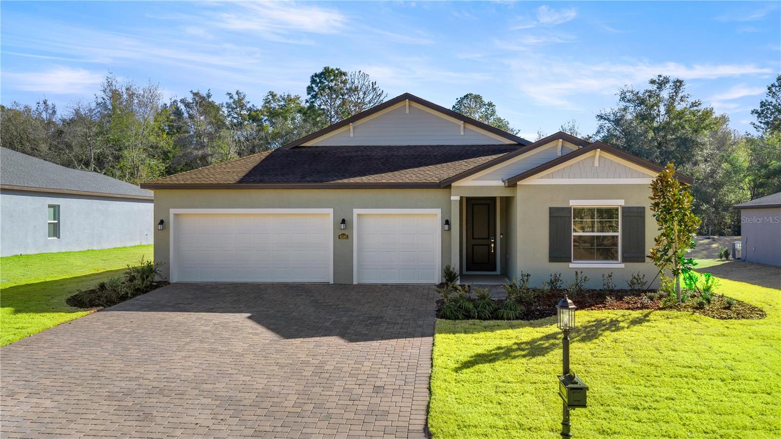 This new single-story home is perfect for ease of living. Two secondary bedrooms share a bathroom in the hall at the front of the home, while the owner’s suite is tucked away on the opposite end with a private bathroom. Down the foyer is the free-flowing open living area, which includes a multifunctional kitchen, a spacious family room and a lovely dining area with a covered rear porch.