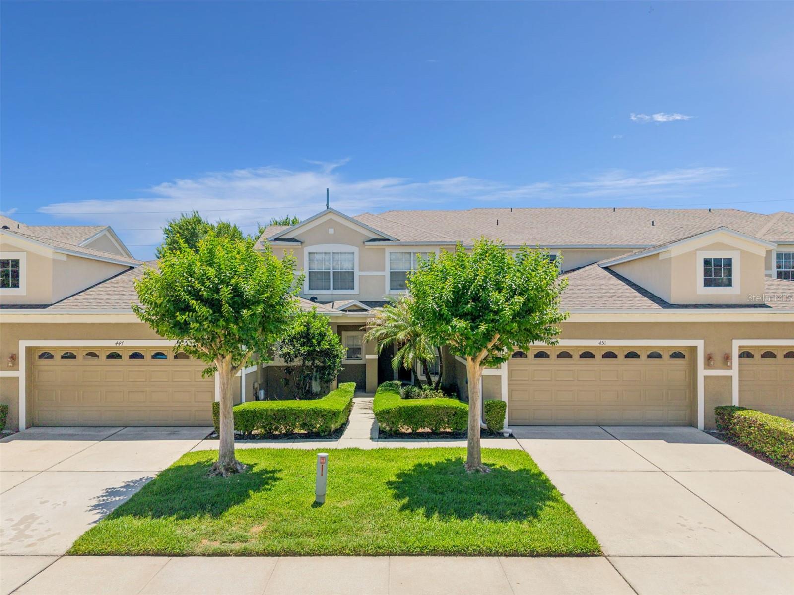 One or more photo(s) has been virtually staged. Welcome to 451 Harbor Winds Court, located in the desirable Winter Springs’ gated community of Harbor Winds! This beautifully maintained and truly move-in ready two-story townhome offers 3 bedrooms, 2.5 bathrooms, and an attached 2-car garage with updates throughout. Major improvements have already been completed for peace of mind, including a new roof, gutters, A/C system, water heater, and stainless steel kitchen appliances—all installed in 2023.

Step inside to discover an inviting floor plan featuring an upgraded kitchen with granite countertops, 42" wood cabinetry, stainless steel appliances, a walk-in pantry, breakfast bar, and a charming breakfast nook perfect for casual dining. The kitchen opens seamlessly to the spacious living area, where sliding glass doors lead to the rear lanai—ideal for relaxing or entertaining.

Upstairs, the spacious primary suite easily accommodates a king-sized bedroom set and features a large walk-in closet along with a private ensuite bath complete with dual vanities, a soaking tub, and a separate glass-enclosed shower. The additional bedrooms provide plenty of space and flexibility for guests or a home office.

Residents of Harbor Winds enjoy access to a resort-style community pool and well maintained neighborhood, all while being conveniently located near shopping, dining, and everyday conveniences. Centrally located with easy access to Orlando’s world-famous attractions, including Walt Disney World and Universal Studios, and less than an hour from the beautiful beaches of New Smyrna and Daytona. Schedule your private showing today, don't miss out!