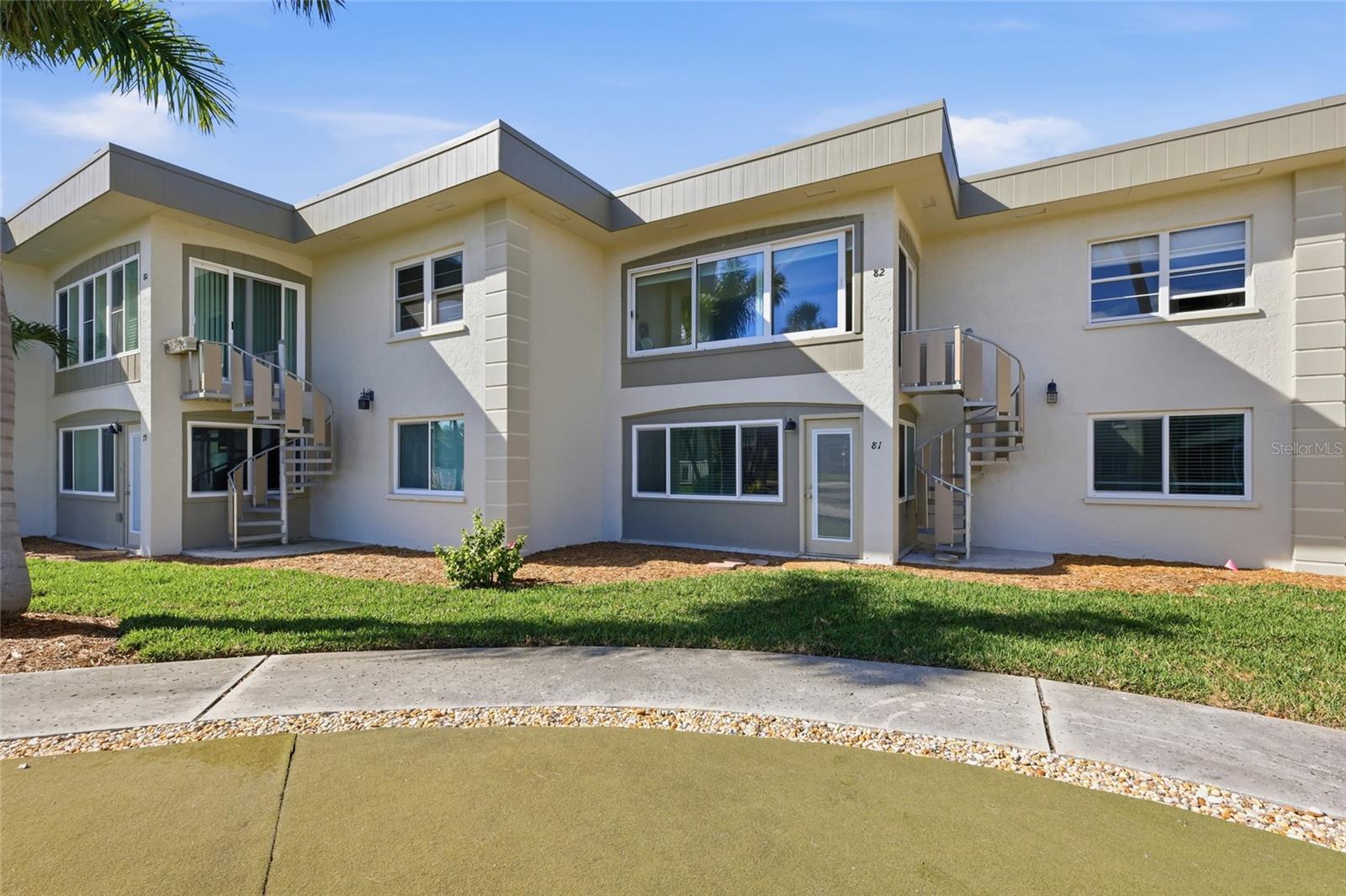 Virtually Staged. Welcome to Shell Point, a lovely waterfront community in the heart of Holmes Beach. If extra space is what you need this unit has it with the back lanai that is all remodeled part of the air conditioned space. This lovely updated condo is conveniently located near the Holmes Beach Boat ramp, tennis courts, basketball courts , dog park, and all within a short stroll to shopping, fabulous dining and of course the beautiful beaches of Anna Maria Island. This lovely 2 bedroom 2 bath unit has been wonderfully updated with beautiful wood grain tile floors, all new appliances, trim, doors, kitchen cabinets, bathroom cabinets, lights, and ceiling fans.  It also boasts new window treatments, and hurricane windows and doors as well.  This little "gem" of an island retreat, has extra interior space (extra square feet)  with the bonus area that is located off of the living room.  This air conditioned interior space has beautiful natural light just pouring in all morning and offers a back door to access the community pool and courtyard which has walking paths.  A perfect space that can be used as an office space, reading space, entertainment space , or just a nice gathering space to rest and sip on your morning coffee.  This unit is all brand new and just waiting for you to start making it your new island retreat.