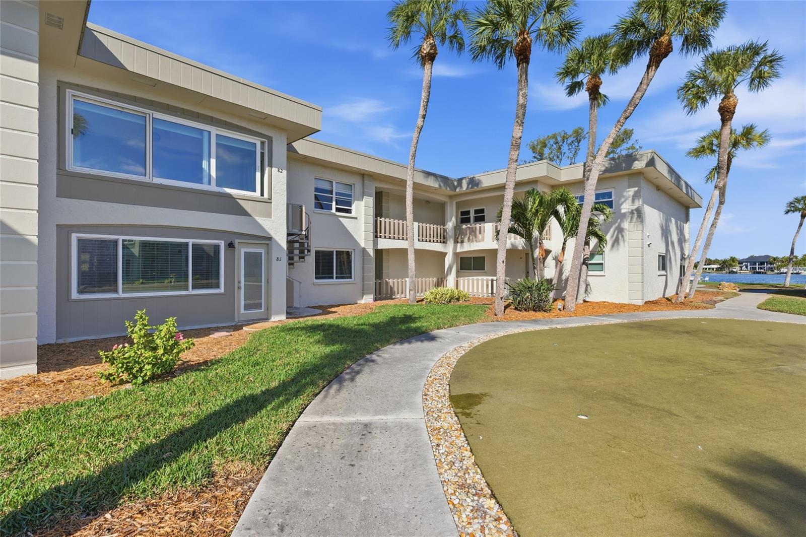 Virtually Staged. Welcome to Shell Point, a lovely waterfront community in the heart of Holmes Beach. If extra space is what you need this unit has it with the back lanai that is all remodeled part of the air conditioned space. This lovely updated condo is conveniently located near the Holmes Beach Boat ramp, tennis courts, basketball courts , dog park, and all within a short stroll to shopping, fabulous dining and of course the beautiful beaches of Anna Maria Island. This lovely 2 bedroom 2 bath unit has been wonderfully updated with beautiful wood grain tile floors, all new appliances, trim, doors, kitchen cabinets, bathroom cabinets, lights, and ceiling fans.  It also boasts new window treatments, and hurricane windows and doors as well.  This little "gem" of an island retreat, has extra interior space (extra square feet)  with the bonus area that is located off of the living room.  This air conditioned interior space has beautiful natural light just pouring in all morning and offers a back door to access the community pool and courtyard which has walking paths.  A perfect space that can be used as an office space, reading space, entertainment space , or just a nice gathering space to rest and sip on your morning coffee.  This unit is all brand new and just waiting for you to start making it your new island retreat.