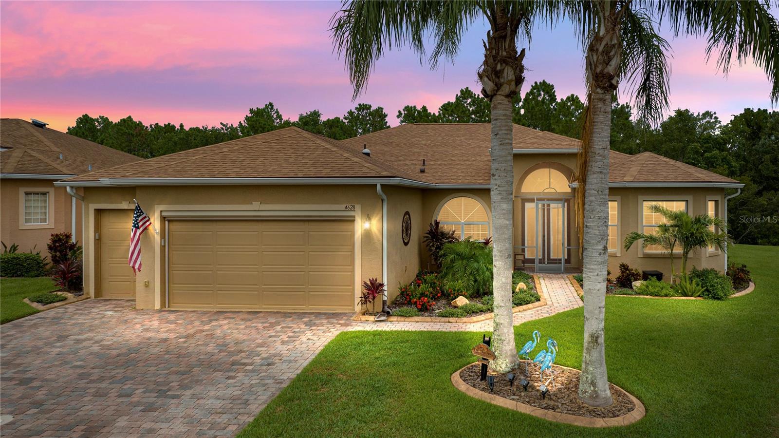 Price Improvement!  This marvelous pool home in Lake Ashton, central Florida’s finest 55+ active-adult community, is a stunning example of beauty and amenities for a personal, private oasis.  Enhancing the curb appeal are stately palm trees, professional landscaping, custom plantings, and custom curbing.  The main garage door is insulated and has an electric, retractable screen.  A golf cart garage is part of the spacious garage area and both garage doors have keyless entry.  A new roof was installed in April 2021 and new air conditioning system in 2017.  Paver drive and walkway.  The front entry is screened and leads to beautiful glass-insert, double front doors with a half-moon window over the transom.
The home’s interior features 18” ceramic tile floors set on the diagonal with carpet in the master bedroom and Luxury Vinyl Plank flooring in the guest bedrooms.  Four sets of 8’ sliding glass doors provide abundant natural light as well as a panoramic view of the lanai, pool, pond, and conservation area beyond.  Two of the sliders have screens for excellent cross ventilation.  All glass sliding doors have new custom blinds.  Living room sliders have a motorized retractable screen that offers great cross ventilation. The kitchen features stunning quartz counters, solid wood cabinets and a new double-oven range and refrigerator.  A large walk-in pantry provides abundant storage. The hot water heater is new, and the home has a Culligan water softener with reverse osmosis.  There are 3 solar tubes for additional, natural light and the interior boasts fresh paint.  One of the guest bedrooms has a built-in combination wall safe.  All house windows have been rescreened and have Plantation Shutters.
At the back of the home – welcome to your personal oasis!  The screen cage has been extended the length of house and measures 64’ x 24’.  The patio was extended from the pool deck north to the house wall and has epoxy flooring. The entire structure was rescreened.  A Paradise Grills outdoor kitchen consisting of 2 – 8’ sections - including grill, rotisserie, griddle, 2 side burners and smoker box was installed.  Each 8’ section has a refrigerator.  Additional electrical outlets were added to the grill side.  The entire outdoor kitchen and two bar stools convey with purchase.  Bluetooth speakers and color changing led lights added.  The grill area has a 20’ retractable, remote-controlled awning with wind sensor and LED lights.  The pool has a 16’ retractable, remote-controlled awning with wind sensor and LED Lights.  The veranda has new paddle fans.  The salt-water pool measures 12’ x 24’ with depth ranging from approximately 3’ to 5’ 6” making it ideal of the grandchildren.  A spa is attached to the pool.  Pool pump and heater are new.  The manual pool cover roller for solar blanket conveys with purchase.  This is an exquisite property!  Schedule your personal showing today!