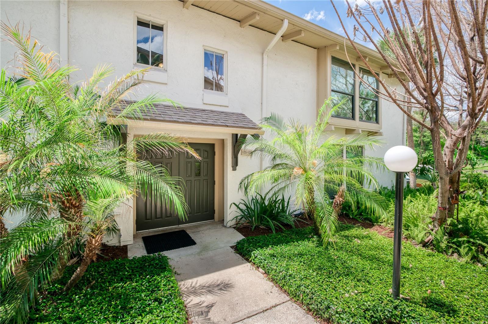 Welcome to lakeside living in the desirable Capistrano Condominium community on beautiful Lake Orienta. This well-maintained 2-bedroom, 2-bath end-unit condo offers both comfort and convenience in a resort like setting.  Step inside to the second floor unit and find tile flooring throughout and an expanded living room that creates an open, airy feel—perfect for relaxing or entertaining. Each room features warm wood-accented vaulted ceilings, adding character and charm to the space. A convenient in-unit laundry closet adds to everyday ease along with the replacement of the AC in 2020 and the water heater in 2023.  Enjoy quiet mornings or evenings with serene lake views, all from the privacy of this ideally positioned end unit.  Capistrano residents enjoy a variety of amenities including two swimming pools, a fitness center, tennis court and a clubhouse—providing a true resort-style lifestyle.  Ideally located just minutes from I-4, AdventHealth, numerous medical offices and the shopping and dining destinations of Altamonte Springs and Maitland, this condo offers both tranquility and accessibility.  A beautifully cared-for property in a prime location—this is lakefront living at its best.