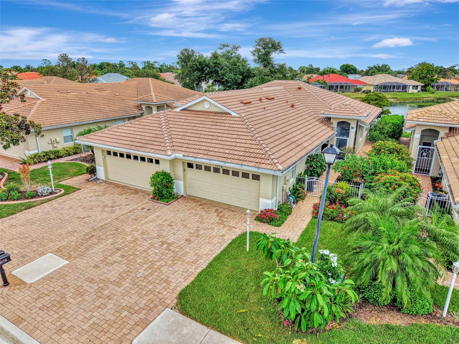 YOUR OASIS and MAGNIFICENT FLORIDA LIFESTYLE AWAITS in this RARELY AVAILABLE LAKEFRONT VILLA located only 4 miles from MANASOTA KEY OFFERING SEVERAL MAGNIFICENT BEACHES. You will truly be impressed with this STUNNING END UNIT VILLA with 2 BR/ 2 BA with a TWO CAR GARAGE. Located in the GATED, MAINTENANCE FREE and ACTIVE LIFESTYLE community of OAK FOREST, this Villa would make for the perfect SEASONAL OR YEAR ROUND RESIDENCE. OAK FOREST IS A VERY FRIENDLY, SOCIALLY ACTIVE and PET-FRIENDLY COMMUNITY with extremely low HOA fees of only $262 / month along with LOW TAXES, BASIC CABLE TV , TRASH & RECYCLING PICK UP , AND EXTERIOR LAWN CARE and IRRIGATION, included .. along with ..  NO CDD FEES and NO FLOOD ZONE. As you enter this Villa, you will most certainly appreciate the STUNNING Garden and Beautiful FLOWERS. The Fenced and paved front patio area is the perfect area to relax, dine, entertain and enjoy the Florida SUNSHINE and outdoors all year round. This Beautiful VILLA has just been freshly painted on the exterior and also has a NEW TILE ROOF,  HIGH CEILINGS, an OPEN FLOOR PLAN and stainless steel appliances. This home has been METICULOUSLY maintained and has TILE FLOORING in all of the Main Living Areas. The home has all NEWER APPLIANCES and a Newer AC ( 2019) . The very private and enclosed rear Florida Room with windows and screens is very private and overlooks the SPARKLING LAKE with the beautiful fountain. The Community amenities include: HEATED POOL, FITNESS ROOM, LIBRARY, TENNIS/PICKLEBALL COURTS, BOCCE BALL and a CLUBHOUSE with a full kitchen hosting an array of events all year long. Located ONLY 4 MILES FROM MANASOTA KEY AND THREE MAGNIFICANT BEACHES where you will be sure to relax and enjoy the MANY NEARBY WATERFRONT RESTAURANTS, ENTERTAINMENT VENUES, HISTORIC DEARBORN STREET, BOATING, FISHING, and even KAYAKING. Take a short drive to nearby BEAUTIFUL HISTORIC DOWNTOWN VENICE and enjoy even more FABULOUS BEACHES, RESTAURANTS, SHOPPING, THE VENICE THEATRE, THE VENICE PERFORMING ARTS CENTER, A WEEKLY FARMERS MARKET, and YEAR ROUND FESTIVALS, as well. THIS IS TRULY FLORIDA CARE FREE LIVING AT IT'S BEST !  A 4-POINT HOME INSPECTION HAS ALREADY BEEN DONE to ensure Total Peace of Mind. PLEASE SCHEDULE YOUR SHOWING TODAY .. BEFORE IT’S TOO LATE !!