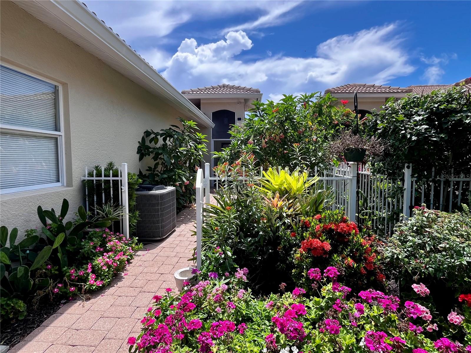 YOUR OASIS and MAGNIFICENT FLORIDA LIFESTYLE AWAITS in this RARELY AVAILABLE LAKEFRONT VILLA located only 4 miles from MANASOTA KEY OFFERING SEVERAL MAGNIFICENT BEACHES. You will truly be impressed with this STUNNING END UNIT VILLA with 2 BR/ 2 BA with a TWO CAR GARAGE and Flex Room , which could be utilized as either an additional Office Combo with Den Area, should you not wish a formal dining area.   Located in the GATED, MAINTENANCE FREE and ACTIVE LIFESTYLE community of OAK FOREST, this Villa would make for the perfect SEASONAL OR YEAR ROUND RESIDENCE. OAK FOREST IS A VERY FRIENDLY, SOCIALLY ACTIVE and PET-FRIENDLY COMMUNITY with extremely low HOA fees of only $262 / month along with LOW TAXES, BASIC CABLE TV , TRASH & RECYCLING PICK UP , AND EXTERIOR LAWN CARE and IRRIGATION, included .. along with ..  NO CDD FEES and NO FLOOD ZONE. As you enter this Villa, you will most certainly appreciate the STUNNING Garden and Beautiful FLOWERS. The Fenced and paved front patio area is the perfect area to relax, dine, entertain and enjoy the Florida SUNSHINE and outdoors all year round. This Beautiful VILLA has just been freshly painted on the exterior and also has a NEW TILE ROOF,  HIGH CEILINGS, an OPEN FLOOR PLAN and stainless steel appliances. This home has been METICULOUSLY maintained and has TILE FLOORING in all of the Main Living Areas. The home has all NEWER APPLIANCES and a Newer AC ( 2019) . The very private and enclosed rear Florida Room with windows and screens is very private and overlooks the SPARKLING LAKE with the beautiful fountain. The Community amenities include: HEATED POOL, FITNESS ROOM, LIBRARY, TENNIS/PICKLEBALL COURTS, BOCCE BALL and a CLUBHOUSE with a full kitchen hosting an array of events all year long. Located ONLY 4 MILES FROM MANASOTA KEY AND THREE MAGNIFICANT BEACHES where you will be sure to relax and enjoy the MANY NEARBY WATERFRONT RESTAURANTS, ENTERTAINMENT VENUES, HISTORIC DEARBORN STREET, BOATING, FISHING, and even KAYAKING. Take a short drive to nearby BEAUTIFUL HISTORIC DOWNTOWN VENICE and enjoy even more FABULOUS BEACHES, RESTAURANTS, SHOPPING, THE VENICE THEATRE, THE VENICE PERFORMING ARTS CENTER, A WEEKLY FARMERS MARKET, and YEAR ROUND FESTIVALS, as well. THIS IS TRULY FLORIDA CARE FREE LIVING AT IT'S BEST !  A 4-POINT HOME INSPECTION HAS ALREADY BEEN DONE to ensure Total Peace of Mind. PLEASE SCHEDULE YOUR SHOWING TODAY .. BEFORE IT’S TOO LATE !!