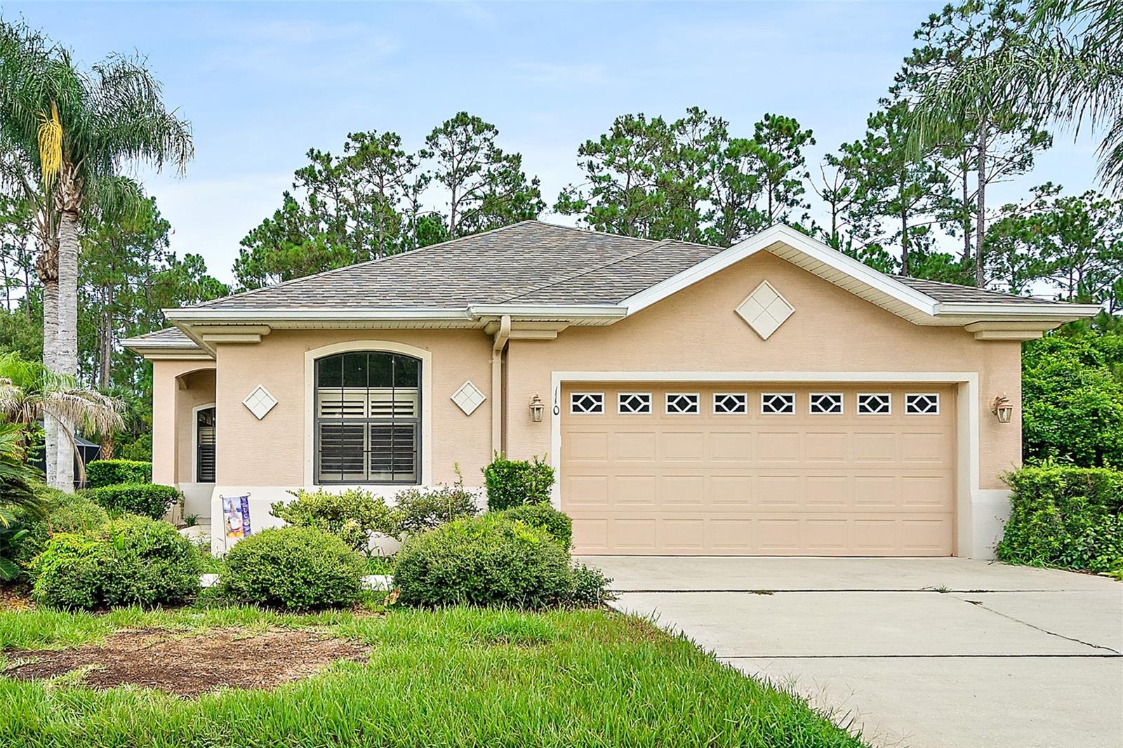 Beautiful 3-bedroom, 2-bath block home in Grand Landings that's loaded with upgrades and ready to welcome you home! From the high ceilings, tray ceilings, rounded corners, and 8-foot doors to the plantation shutters and art niches, every detail adds charm and character. The spacious primary suite features a walk-in shower, while the third bedroom offers glass French doors, making it perfect for a home office or guest space. The kitchen shines with granite countertops, tile backsplash, stainless steel appliances, and tall hardwood cabinetry. Outside has a large covered and windowed Florida room with tile floors. Back overlooks preserve land for added privacy. Huge bonus is this parcel is oversized at over 15,500sf or .35 acres. Don't miss your opportunity to make this stunning home yours—schedule your private showing today!
