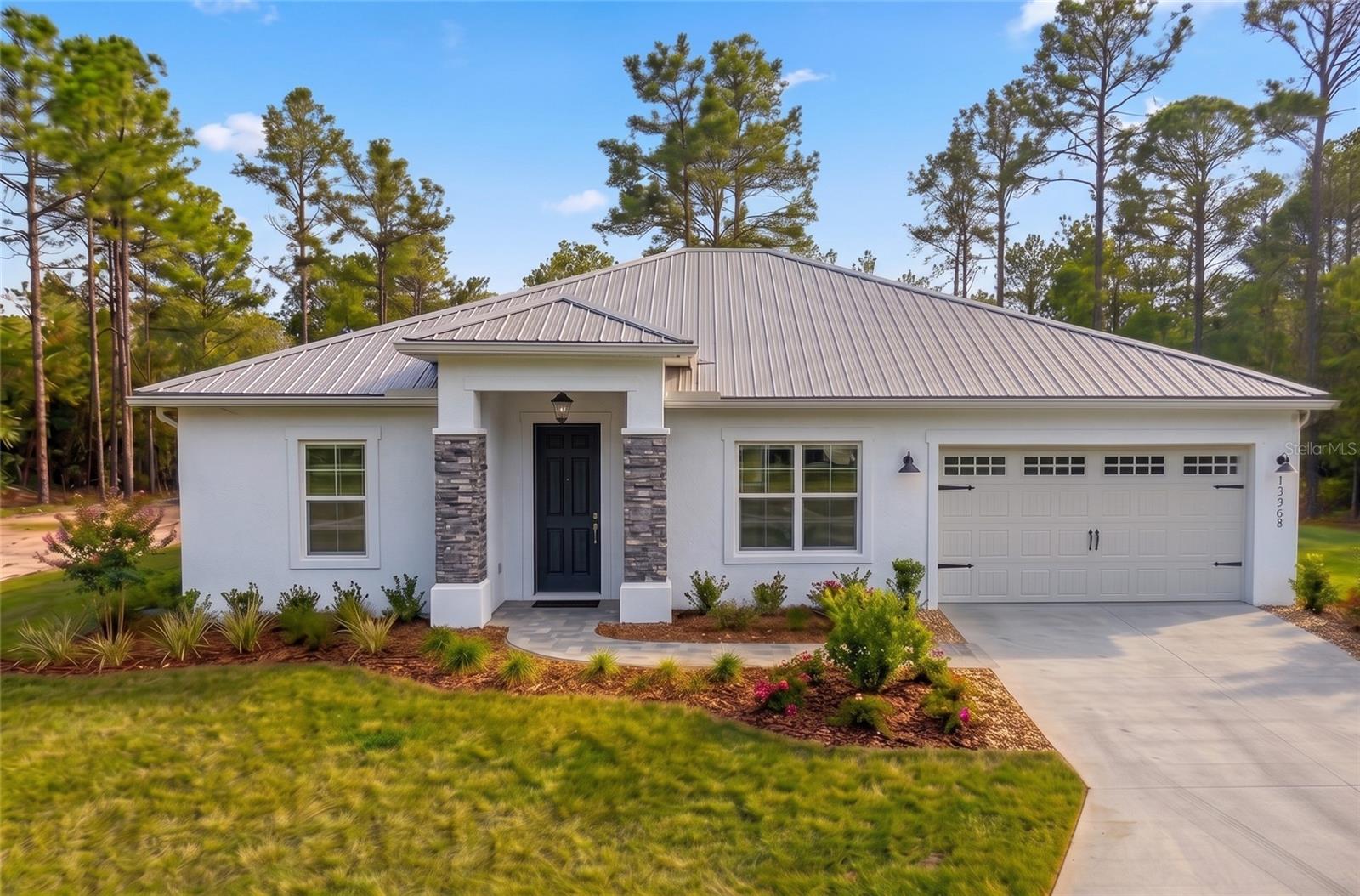 Virtually Staged. Under Construction. Beautiful brand new construction on 1.03 ACRES from Marion County's most sought after builder. Located in Rainbow Lakes Estates. NO HOA This home boasts a large open split floor plan that allows plenty of natural light into the living areas!! 4 bedroom, 2 bathroom 2 car garage. High end finishes include shaker style solid wood cabinets, granite countertops; Stainless steel appliance package in the kitchen; Primary suite features trayed ceiling, large walk-in closet, tiled walk-in shower. Metal roof. This home will not last long GUARANTEED! Check out the covered back patio. This home is just a few weeks from completion. MAKE IT YOURS TODAY!