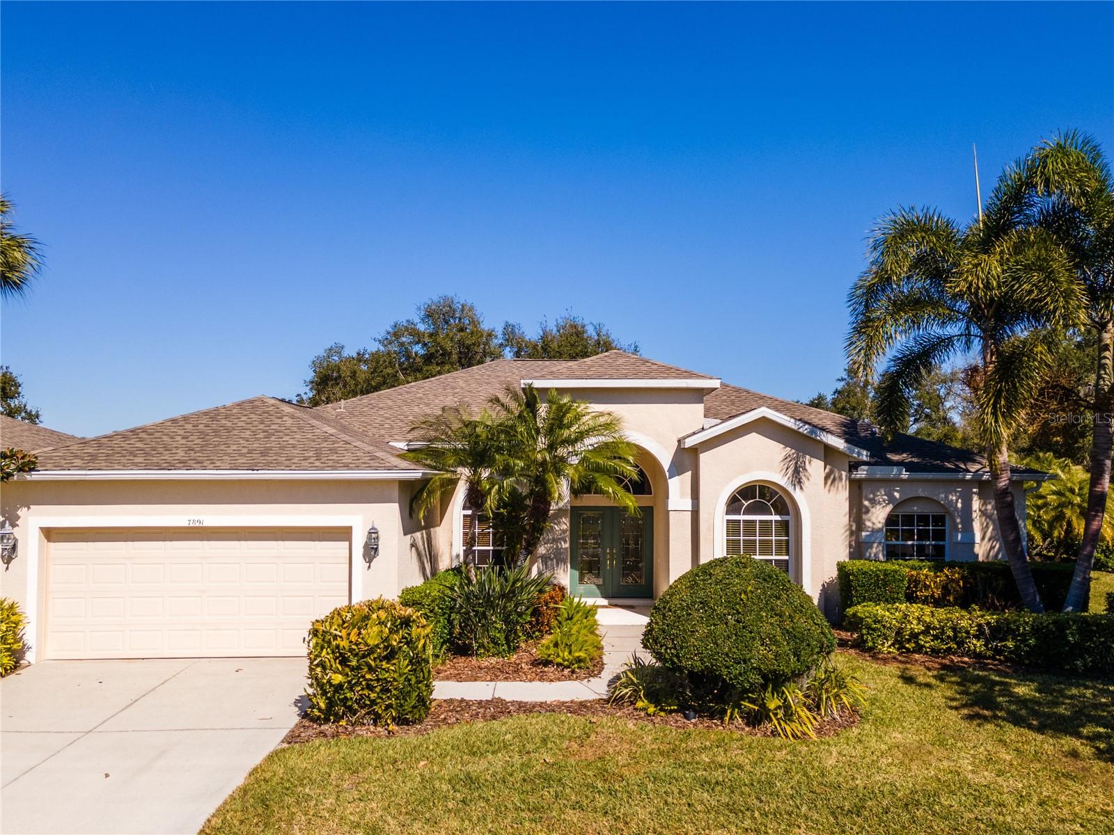 This beautifully designed 3-bedroom, 3-bathroom residence offers a spacious and thoughtfully crafted floor plan ideal for both everyday living and elegant entertaining. Situated on a large homesite within a gated, maintenance-free community, this home combines privacy, convenience, and exceptional lifestyle amenities.
Upon entry, you are welcomed by a formal living room filled with natural light, complemented by a separate dining room perfect for hosting gatherings and special occasions. A private study provides an ideal space for working from home or quiet retreat. The expansive family room flows seamlessly into the kitchen, creating an inviting open-concept living space.
The well-appointed kitchen features a charming breakfast nook overlooking the pool and lanai, offering the perfect setting for casual dining. Sliding glass doors enhance the indoor-outdoor connection and fill the home with abundant natural light.
Step outside to a large screened lanai showcasing a sparkling pool and convenient pool bath—designed for effortless outdoor entertaining and year-round enjoyment. The spacious primary suite and additional bedrooms offer privacy and comfort, while three full bathrooms ensure convenience for family and guests alike.
Residents enjoy a truly maintenance-free lifestyle with all exterior lawn care included in the low HOA fee, annual pressure washing of driveways and sidewalks, and fresh mulch installed yearly. The neighborhood is beautifully maintained with mature landscaping, scenic lakes, and abundant greenspace throughout.
Ideally located close to grocery stores, restaurants, and fitness centers, and just a short drive to UTC, SRQ Airport, and the area’s renowned Gulf beaches, this home delivers the perfect blend of comfort, elegance, and convenience.