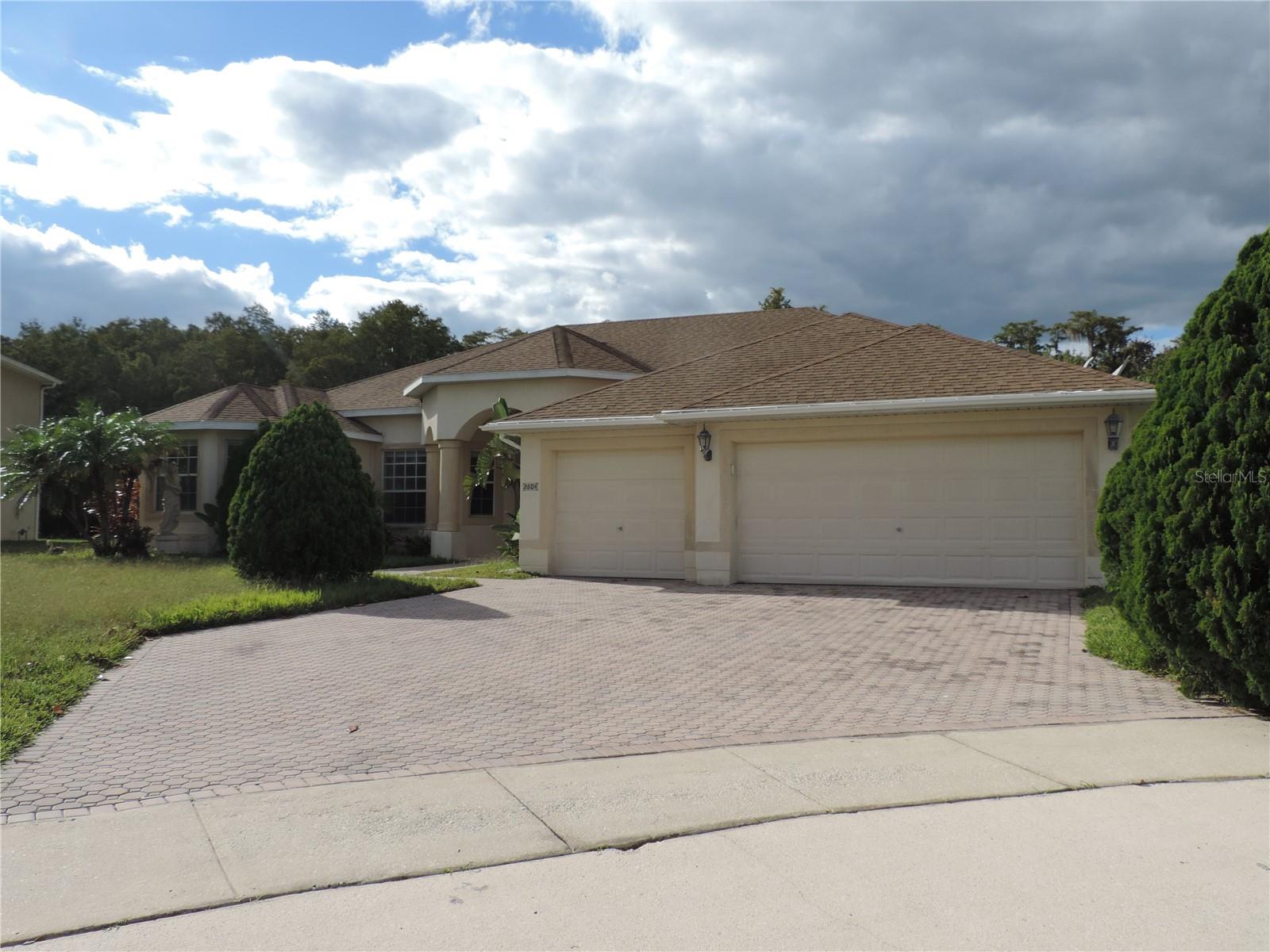 One or more photo(s) has been virtually staged. Welcome to 2604 Lutza Way, a spacious and beautifully designed home tucked away on a quiet cul-de-sac in the desirable Brighton Lakes community of Kissimmee, Florida. This impressive residence offers 4 bedrooms, 3 full bathrooms, plus a dedicated den, providing exceptional flexibility for a home office, guest suite, or playroom. With 3,430 square feet of living space, the open and functional floor plan is ideal for both everyday living and entertaining. Enjoy the convenience of a 3-car garage, generous room sizes, and a layout designed for comfort and privacy. The cul-de-sac location adds a sense of exclusivity while minimizing traffic—perfect for relaxed Florida living. Located just minutes from shopping, dining, top attractions, major highways, and Orlando theme parks, Brighton Lakes is a gated community known for its resort-style amenities and prime location. More than one picture is digital staged