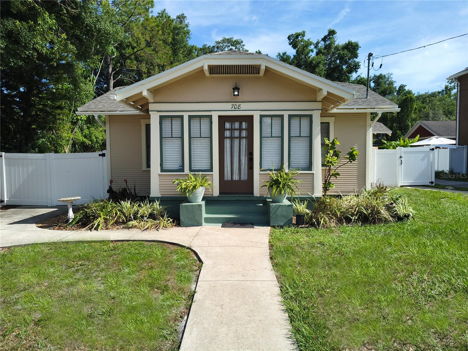 Welcome to your dream home in one of Tampa’s most coveted neighborhoods! Nestled in the vibrant and highly desirable Old Seminole Heights, this meticulously updated 2-bedroom, 1-bathroom bungalow, blends modern elegance with timeless charm. Nearby parks include Henry and Ola Park which features a baseball field, soccer field, playground, and dog park, and also the scenic Epps Park along the tranquil Hillsborough River. Plus, you’re just minutes from the bustling energy of Downtown Tampa and surrounded by the eclectic shops and restaurants of Seminole Heights, offering everything from craft cocktails to global comfort food. This move-in-ready gem radiates curb appeal with fresh paint inside and out. The gourmet kitchen is a chef’s delight with all-wood cabinetry, granite countertops, breakfast bar and modern stainless steel appliances, perfect for culinary creations and entertaining. The beautiful bathroom features a clawfoot tub & wainscoting. Ample closet space meets all your storage needs, and energy-efficient upgrades like a new roof and new air conditioner in 2025. Step into the expansive, fully fenced backyard, enclosed with a vinyl fence for privacy and security. Enjoy al fresco dining or relaxing on the covered 12x17 wood deck, ideal for BBQs or morning coffee. A dedicated laundry room with washer/dryer hookups add practical functionality. The large backyard offers endless possibilities for gardening, play, or future expansions. This turnkey home combines modern upgrades with the enduring appeal of Old Seminole Heights, where tree-lined streets, a tight-knit community, and a vibrant dining and shopping scene create an unmatched lifestyle. Whether strolling to nearby parks, exploring the riverfront, or enjoying Downtown Tampa’s attractions just minutes away, this location has it all. Perfect for first-time buyers, downsizers, or anyone seeking a high-style retreat. Don’t miss your chance to own a piece of Tampa’s historic charm with all the modern comforts you crave!