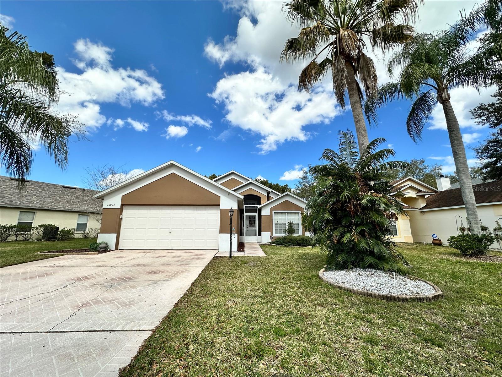 Beautifully maintained 3-bedroom, 2-bathroom home located in the desirable Clermont area, offering peaceful greenbelt views and no rear neighbors. This move-in-ready home combines privacy, comfort, and extensive recent upgrades that provide exceptional value and peace of mind.

The spacious single-story floor plan features inviting living and dining areas, a bright kitchen with granite countertops, and a screened lanai overlooking the private backyard and natural green space. The split-bedroom layout provides added privacy and functionality for both homeowners and guests.

Major recent improvements include:

All new energy-efficient replacement windows installed in 2024;
Lifetime Limited Warranty on the window system with transferability to the successor owner;
New hurricane-rated garage door (120 MPH wind resistance) installed in 2024;
New 50-gallon electric water heater installed in 2024;
Roof replaced in 2017;
3-ton 15 SEER heat pump HVAC system installed in 2013;

These significant upgrades enhance energy efficiency, reduce future maintenance concerns, and may provide potential insurance and utility savings.

Enjoy the privacy of a backyard with no rear neighbors and tranquil greenbelt views. Residents also benefit from a community pool that is conveniently located just a 5-minute walk from the home, making it easy to enjoy Florida's outdoor lifestyle year-round.

Conveniently located near shopping, dining, major highways, attractions, and Central Florida's world-famous theme parks, this home is ideal as a primary residence, vacation home, or investment property.

This well-cared-for home offers a rare combination of privacy, location, and major system upgrades already completed for the next owner. Don't miss the opportunity to own this exceptional Clermont property where comfort, efficiency, and convenience come together.