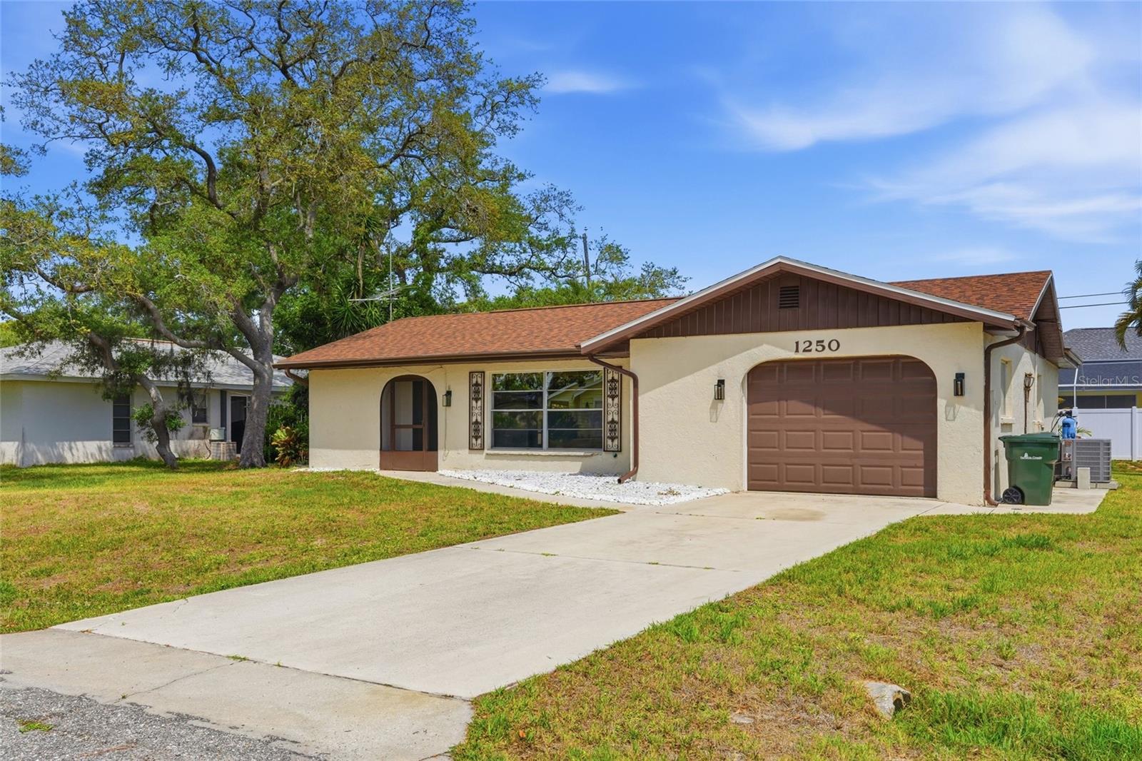Welcome to this beautifully updated South Venice home offering 2 bedrooms, 2 baths, a 1-car garage, and an oversized 20'x8' Florida Room that provides incredible flexibility. Whether you need a home office, exercise room, hobby space, additional living area, playroom, card room, or the perfect spot for Mahjong with friends, this bonus space can easily adapt to your lifestyle. Recent improvements provide peace of mind and modern comfort, including a new roof in 2025, two newly tiled walk-in showers, new vanities, a new AC system and ductwork, new interior paint, and a new leach field installed in 2021. Split bedroom plan allows for privacy for family or guests. Primary suite has a large walk-in closet with built in storage. With a spacious, fenced yard, there is room for pool, for pets to roam, and plenty of space for entertainment.  One of the unique perks of living in South Venice is an optional access to the South Venice Beach Ferry. For just $200 annually, residents can enjoy a quick ferry ride to a private beach on the Gulf, offering a true slice of paradise! Ideally located just minutes from the charming boutiques, dining, and cultural attractions of Downtown Venice, as well as the beautiful shores of Venice Beach, this home combines thoughtful updates, flexible living space, and an exceptional Florida lifestyle.