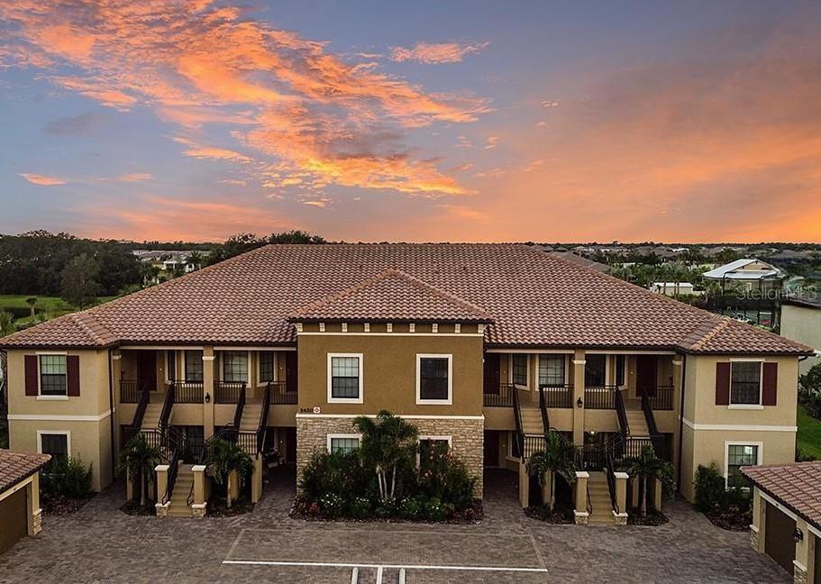 “Turnkey Furnished” vacation get-away, second home, investment property, or permanent residence on Palmer Ranch!  This is a beautifully maintained open floor plan, second floor unit (includes garage) in the Garden Homes at Esplanade on Palmer Ranch.  A great location within the community and offers a Kitchen with granite countertops, stainless steel appliances, crown molding and tile floors throughout and plush carpet  in the two bedrooms.  Building ten is located close to the amazing, premier Amenity Campus, clubhouse, catering kitchen, which features a resort style pool, signature “Bahama Bar” for food and beverages, state of the art fitness center with cardio and strength rooms, free weight and movement studio.  (Classes and personal training also available.)  Continuing on, the community also features poolside cabanas and poolside drink and towel service, Indoor Table Tennis, Coquina Sands spa, bocce, tennis, resistance pool, splash pad, hot tub/spa, playground and Pickleball courts, and let's not forget the dog park...  Esplanade provides easy access to the Legacy Trail via either of the two entrances from the community and is not only GATED, but also maintenance free!  This is truly resort-style living with a full-time on-site Lifestyle Manager & Director, making it easy to make new friends and enjoy special events, activities, & parties!  Perfect location not far from downtown Sarasota, several Gulf beaches (SIESTA KEY white sand beach!), boat docks, marina's & kayak launches.  A perfect lifestyle which makes Palmer Ranch a go-to destination for visitors and residents.  Constructed by one of Florida's most reputable builders, this community features some of the best amenities offered in Sarasota County!  LOCATION & LIFESTYLE!