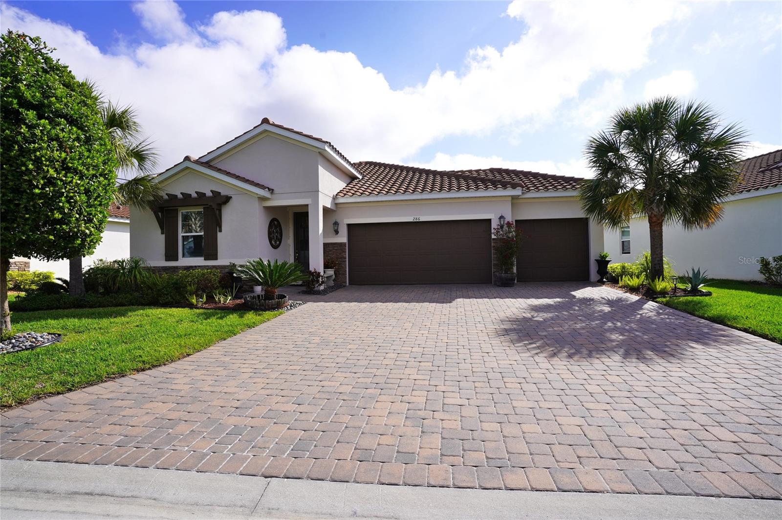 This pristine waterfront  3/2/3 car garage is a breathtaking like model home in a gated community.
286 Daylily Blvd is a 2,093 square foot home with 3 bedrooms Plus an additional room with 2 bathrooms and 3 car garage with additional parking space.
This smart home is located in Venice Woodlands with no CDD fee and low HOA fee.  Home was built in 2021 and has no need for flood insurance.  The house sits in X, flood zone (No flood zone).  New hot water tank 2026.
Enjoy your morning coffee with the sunrise from your Lanai which leads to an outdoor paved patio area with a view of the lake.  Inside the home you'll find beautiful tile floors throughout the main living area and carpet in the bedrooms.  Primary bedroom includes an en suite bathroom with walk-in closet and dual vanity with granite counter tops.  Guest rooms have large walk in closets for plenty of storage. The kitchen comes with all upgraded appliances that include a glass top stove with convection oven, microwave, refrigerator, and dishwasher.  42" kitchen cabinets, walk-in pantry, canned and pendant led lighting and granite counter space.  The laundry room includes a utility sink with extra large cabinets.  Reverse  osmosis with filtered salt water system throughout the home.
Walk to your club house fitness center or pool for your quick workout before or after work.
Seller paid buyer's closing cost up to $5,000 (credit at the closing table).
Close to local amenities, beaches, and Tiki Bars and Live entertainment. The best game fishing in the world with off speed boat racing to spring training baseball teams as The Atlanta Braves and Tampa Rays. Just want to go to the beach or go fishing for the day. Great to do it all with whatever you can dream or do as a hobby. Local International Airports: Fort Myers, Sarasota and local Punta Gorda with Allegiant airlines direct. Many outdoor concert venues weekly. Local parks, state parks, tennis or pickle ball, to amazing golf courses. You deserve to view this property and make it your home or investment.
