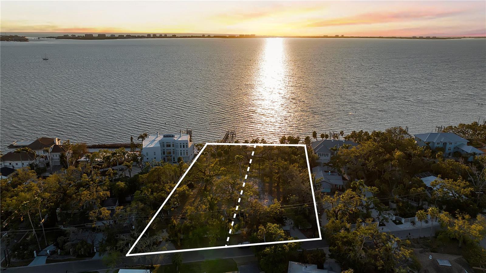 Positioned along the sparkling waters of Sarasota Bay, this extraordinary 1.7 acres of direct bayfront property presents a rare opportunity to create one or two landmark waterfront estates within one of Sarasota’s most desirable coastal settings. Comprised of two separate parcels, 2043 & 2046 Alameda Way, the property offers remarkable flexibility for an end user, developer, or multigenerational compound vision. Boasting an impressive 210 feet of direct bay frontage, the property captures panoramic open water views, breathtaking year-round sunsets, and exceptional boating water with a private dock already in place. The expansive footprint allows for the creation of one grand estate spanning both parcels or two significant luxury residences, each with its own commanding presence on Sarasota Bay. Custom estate plans have been designed for each parcel by renowned Choeff Levy Fischman Architecture + Design, thoughtfully envisioning world-class waterfront living that complements the scale, setting, and prestige of this exceptional offering. Tucked within a quiet waterfront enclave, the location offers privacy and tranquility while remaining moments from Downtown Sarasota’s acclaimed dining, shopping, arts, and cultural scene. Enjoy close proximity to the new The Bay Park, the iconic The John and Mable Ringling Museum of Art, and the convenience of Sarasota-Bradenton International Airport. An extraordinarily rare offering defined by scale, frontage, flexibility, and location, representing the opportunity to build one or two of Sarasota’s most significant bayfront residences.