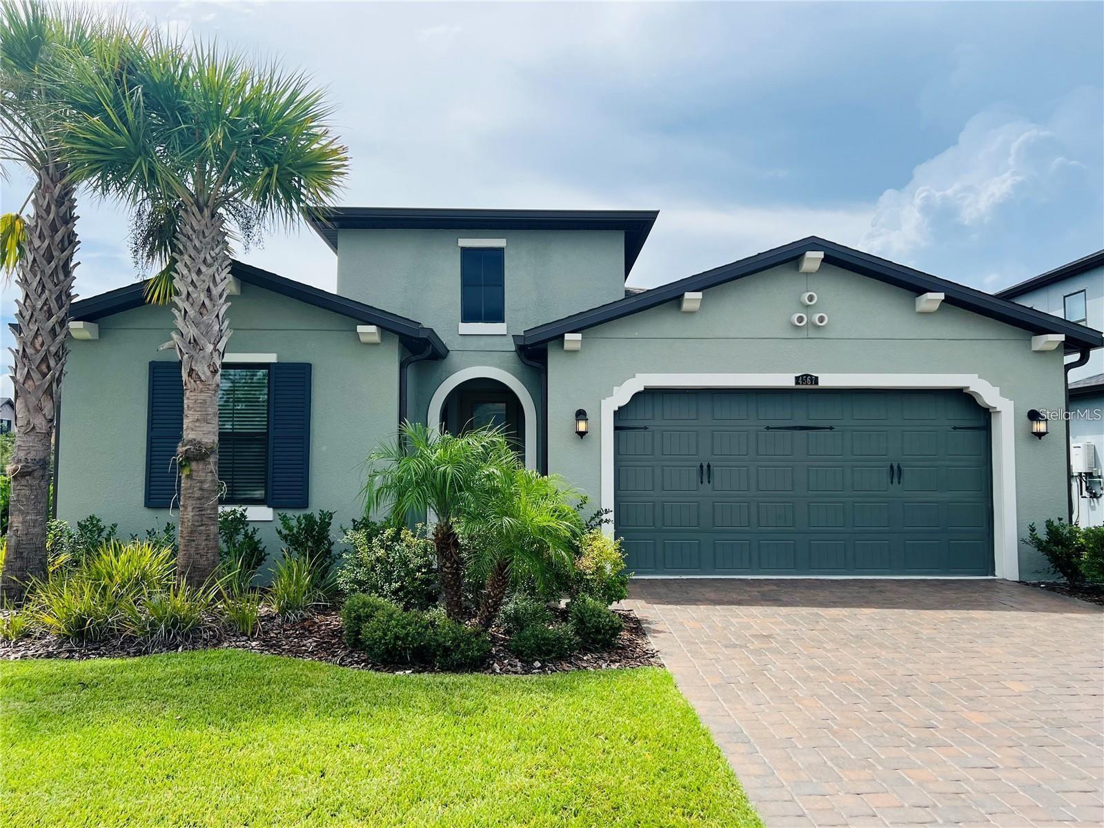 Welcome to 4567 Tivoli Dr, Wesley Chapel, FL 33543 – a stunning home located on a corner lot in the highly sought-after, gated community of Cortona within Estancia. This spacious residence boasts 3 bedrooms, 3 full bathrooms, and a bonus study/den that can easily serve as a 4th bedroom. The home features upgraded wood-style tile flooring throughout, and the Chef’s kitchen, as well as every bathroom, is adorned with elegant quartz countertops. The large owner’s suite offers a serene retreat with a spa-like bathroom, while the second bedroom has its own private full bath, perfect for guests or family members. The third bedroom is conveniently located near a full bathroom with dual sinks and a tub. Outdoor living is a dream with a patio featuring upgraded travertine pavers and a fully fenced yard with luxury iron rod fencing and meticulously maintained landscaping. The 2-car garage includes upgraded epoxy flooring. This home is situated just steps from the bus stop, offering easy access to top-rated schools. As part of the Estancia community, residents enjoy resort-style amenities including a lap pool, walk-in beach-style resort pool with a 3-story water slide, a full fitness center, sand tennis courts, pickleball courts, basketball courts, dog parks, and beautifully landscaped sidewalks throughout the neighborhood. Landscaping and pest control are fully maintained by the owner, ensuring a stress-free living experience in one of Wesley Chapel’s most desirable and award-winning neighborhoods. Don't miss out on the opportunity to call this exceptional property home!