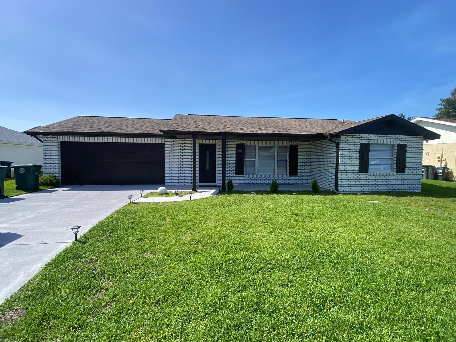 Beautifully remodeled and move-in ready, this stunning 3-bedroom, 2-bath pool home offers the perfect blend of comfort, style, and Florida living in the heart of Daytona Beach. Thoughtfully updated with beautiful finishes and an inviting layout, the home features spacious living areas filled with natural light, a private primary suite with walk-in closet and pool access, and a gorgeous screened-in pool with covered lanai ideal for relaxing or entertaining. The oversized two-car garage provides ample storage, while the lush landscaped yard with irrigation system adds to the home’s charm. Furniture is negotiable, making this an incredible opportunity to move right in and start enjoying the lifestyle without the stress of furnishing or renovating. Ideally located just 6 minutes from the beach, and close to shopping, restaurants, medical facilities, Embry-Riddle Aeronautical University, and the Daytona International Speedway—plus only 1.5 hours from Disney.