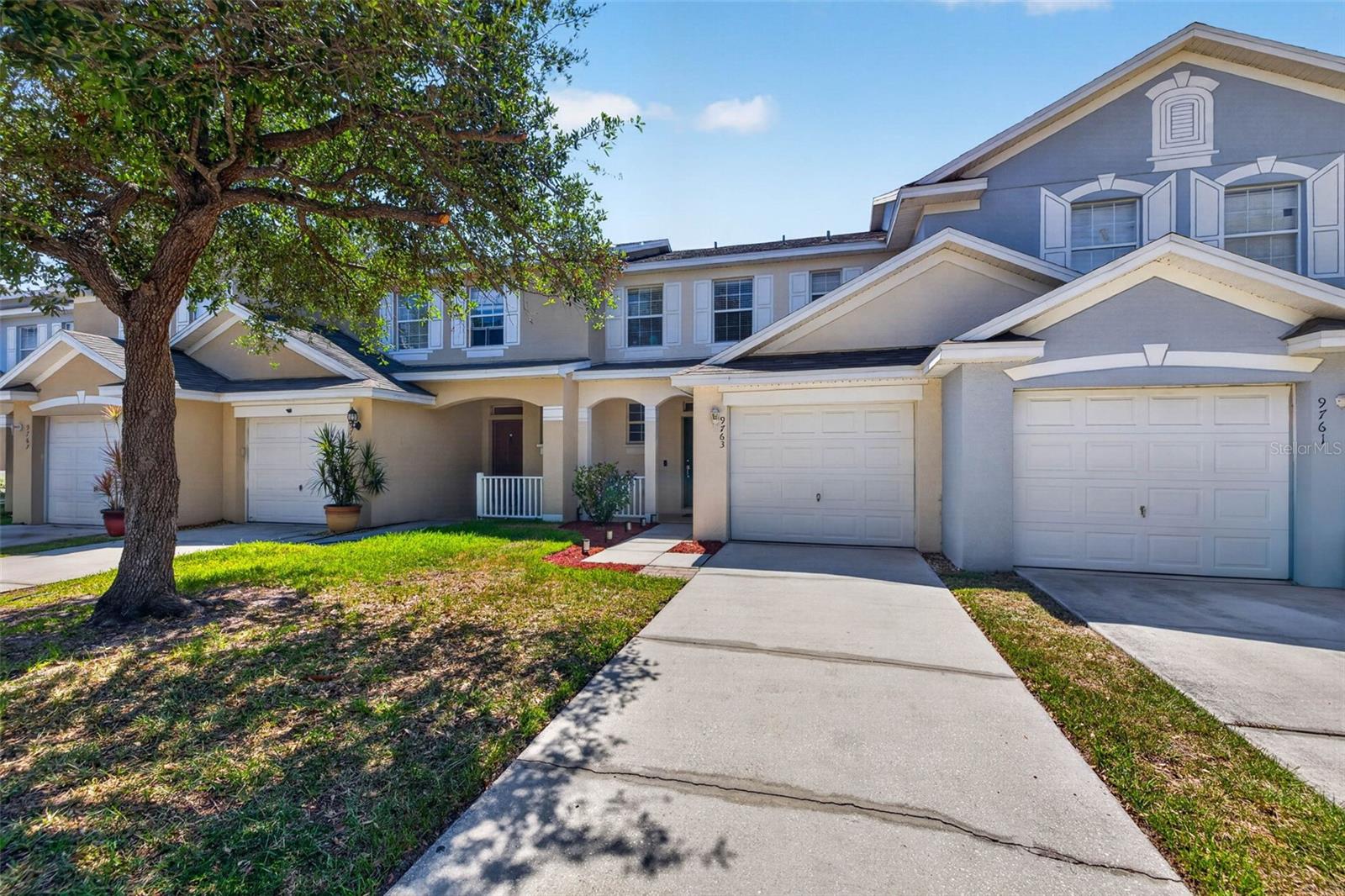 Welcome to this updated townhome located in the Villages of Bloomingdale. This highly desirable unit is located in the back of the community, and the front faces lush Florida foliage directly across the street. This floor plan features two generously sized bedrooms upstairs with their own en-suites and large closets. This floor plan doesn't come available often in the community. Downstairs, you'll find an open-concept living/dining/kitchen space. The downstairs features beautiful woodgrain tile, an updated half bath, a newer dining room light fixture, and fresh paint. The kitchen has been refreshed with new stainless-steel appliances, new countertops, a newer sink/disposal/faucet, new hardware, and a new backsplash. There is a pantry located in the kitchen as well, which is great for additional storage. This unit also comes with a fully fenced-in backyard with a six-foot privacy white vinyl fence. There is parking for two cars in the driveway, parking for one car in the garage, and there is additional guest street parking directly across from the unit. Up the stairs, the two bedrooms and en-suites are divided by a laundry closet (washer and dryer included). The larger en-suite in the rear has a double vanity, a large tub, and great natural light. Both bedrooms upstairs feature vaulted ceilings that make the space feel open and airy. A new A/C system was installed in 2025. You can enjoy everything that the community has to offer with all the following amenities/items included in the monthly HOA fee: community pool, fitness center, clubhouse, playground, lawn care, roof repair/replacement, water, sewer, trash, and exterior maintenance. This community is conveniently located near everything Riverview, Brandon, and Tampa have to offer. You can quickly hop on the Selmon Expressway, I-75, or I-4 and be downtown Tampa in twenty minutes.