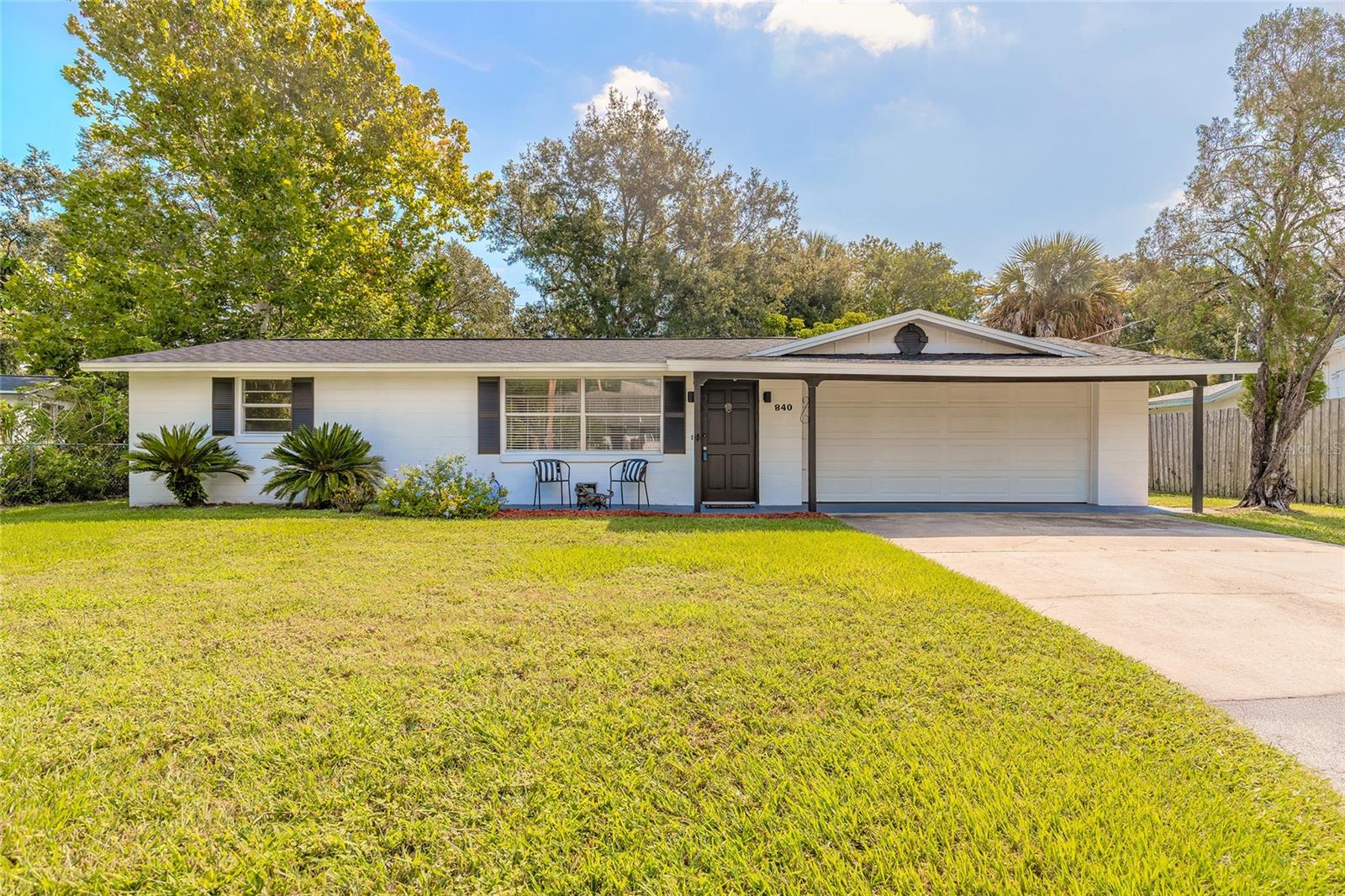 One or more photo(s) has been virtually staged. Discover comfort, style, and convenience at 840 6th Street in Port Orange! This beautifully updated 2-bedroom, 1.5-bath home features two spacious living areas, a glassed-in Florida room, and remodeled kitchen and baths with modern finishes throughout. Fresh interior and exterior paint, new laminate flooring, a brand-new roof, updated electrical panel, and new water heater make this home truly move-in ready.

Outside, enjoy a 2-car garage with attached workshop plus an additional storage shed. Conveniently located near Sugar Mill Elementary and the Port Orange Riverwalk Park, offering playgrounds, splash pad, picnic areas with grills, and kayak rentals with launch access. A perfect blend of updates, functionality, and location!