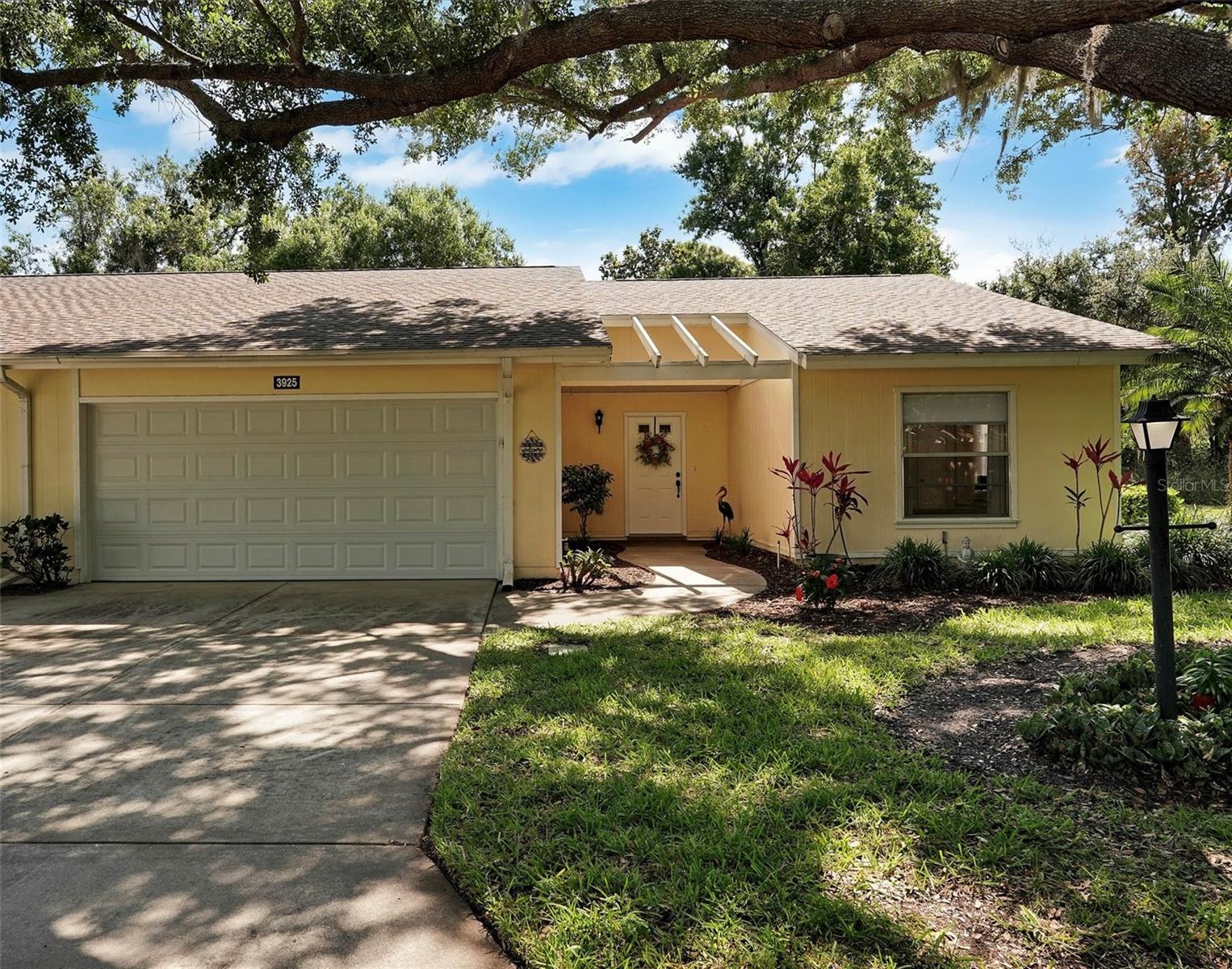 This stunning 2-bedroom,2-bath Villa. Has the feel of a single family home
1374 sq ft, Open concept floor plan with Cathedral ceiling’s .
Included is a 2 car garage and a generous size lanai overlooking the private natural space for you to enjoy.
(Updated and Upgraded)
New luxury vinyl plank flooring , baseboards, paint, ceiling re textured and window coverings throughout the entire home.
Bathrooms have been beautifully updated. Kitchen is brand new with soft closing cabinetry, gorgeous quartz countertops and a upgraded appliance package. All done in 2025!

The HVAC system is 2022 and the hot water heater is 2024.
New Hurricane rated garage door.
To top it off. A brand new roof in 2026.
Oakhurst is a pet friendly 55+ community .
Maintenance fees include :Cable TV, INTERNET, the roof, pest control, exterior maintenance and landscaping are ALL INCLUDED in the monthly condo fee ($662).

This home is a must see to appreciate all it has to offer.