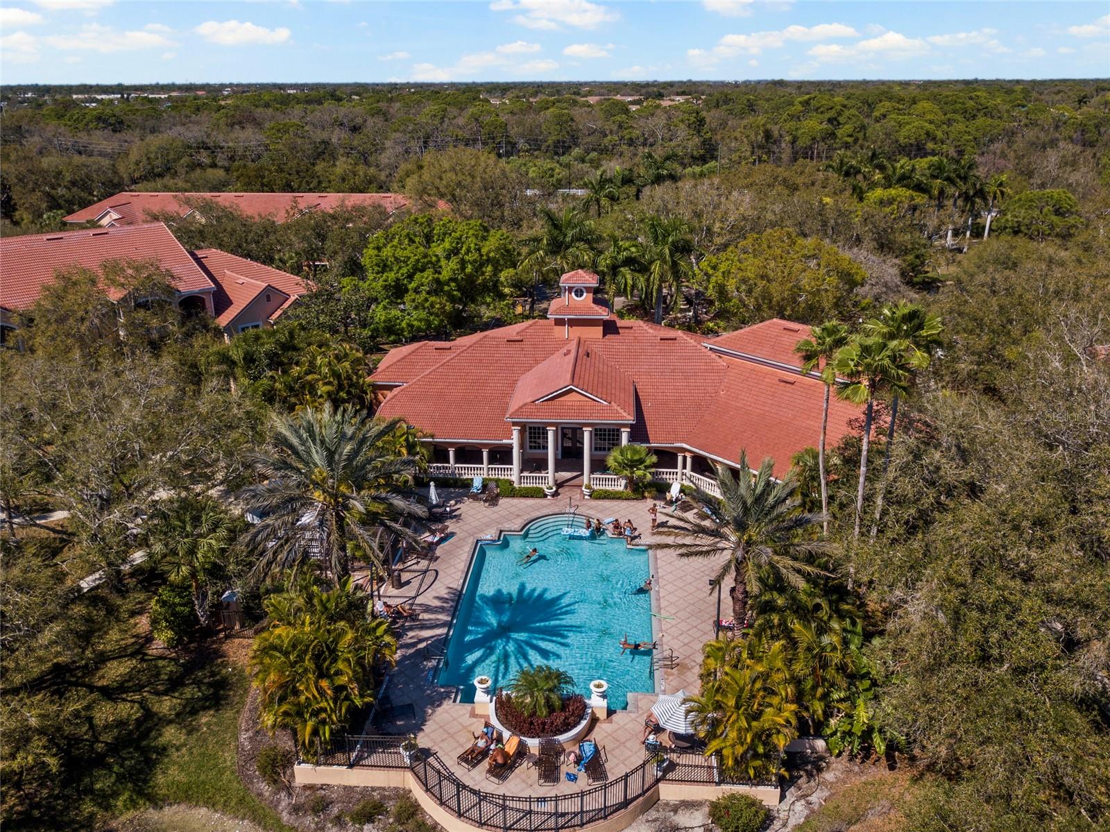 Bella Villino is a highly desirable gated community just minutes from the world-renowned sands of Siesta Key Beach. This beautifully maintained Puccini IV residence is being sold turnkey furnished, making it a convenient move-in ready opportunity. Inside, the home features an airy open layout highlighted by a dramatic cathedral ceiling rising to nearly 13 feet, creating a bright and spacious feel throughout the main living area. The recently updated kitchen includes a functional counter that comfortably seats four and opens to the living space, ideal for everyday living or entertaining. Plantation shutters throughout add timeless style while allowing natural light to fill the home. The sunroom is a standout feature, complete with pocket sliders that open the space to the main living area. A Murphy bed makes this versatile room ideal for guests, a home office, hobby space, or additional living area.

Privacy is another standout feature. This unit shares only one adjoining wall and has no neighbors above or below, significantly reducing noise and creating a peaceful environment. A separate laundry room with washer and dryer is included for convenience, along with a covered carport parking space. Bella Villino residents enjoy a wide range of amenities including a heated swimming pool, hot tub, clubhouse, tennis courts, racquet/basketball court, gas grills, poolside seating areas, and a vehicle detail station. Pet lovers will appreciate the generous policy allowing two pets. The community’s prime location offers quick access to US-41 and I-75, while nearby shopping, dining, and entertainment are only a short drive away. Outdoor enthusiasts will enjoy immediate access to walking and biking paths, with the popular Legacy Trail located just a short distance from the entrance. The monthly association fee is very reasonable and covers exterior maintenance including the roof, water, sewer, trash service, pest control, and the secure gated entrance.