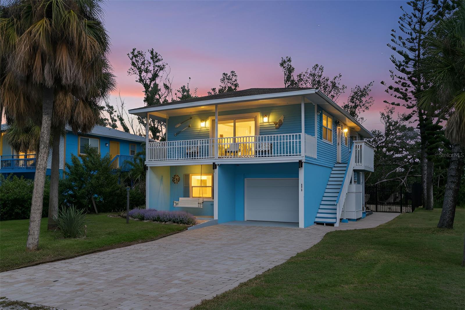 PRIME LOCATION | BRAND NEW RENOVATIONS | ELEVATED-LUXURY-LIVING | ELEVATOR | FENCED SALTWATER POOL | MOVE-IN READY |
Located on a peaceful street and embraced by the natural beauty of a mangrove preserve, this elevated coastal residence delivers privacy, modern luxury, and a coveted Holmes Beach lifestyle. Thoughtfully renovated over seven months between 2023 and 2024 with the owners investing $275,000 in premium renovations and high-end additions, the home blends timeless design with state-of-the-art upgrades—creating a tranquil retreat just moments from award-winning Gulf beaches, local dining, and island conveniences. Inside, sunlit living spaces showcase elegant finishes and open-concept design. The kitchen is a modern showpiece, featuring sleek granite countertops, white shaker cabinetry, under-cabinet lighting, and a reverse osmosis water system. Two spacious bedrooms and two spa-inspired bathrooms offer comfort and style, complemented by plantation shutters, smooth ceilings, and a whole-home water filtration system. No detail has been overlooked—from new electrical wiring and panel with underground service to a NEW GARAGE DOOR AND OPENER (2025) and a fully accessible 750-LB CAPACITY ELEVATOR for effortless living. Outdoors, a private fenced backyard oasis invites relaxation with a BRAND NEW ELEVATED SALTWATER POOL (2025) surrounded by lush tropical landscaping enhanced with $20,000 in new plantings, including orange trees and lavender bushes. The serene mangrove backdrop ensures rare tranquility, natural beauty, and panoramic views from your bedroom. The lower level includes a TWO-CAR TANDEM GARAGE and an additional 480 SQUARE FOOT BONUS ROOM with durable polyaspartic-coated flooring. Currently serving as a spacious room for entertainment this can easily be turned into a gym or extra office space—plus an outdoor shower and additional storage. Zoned for MONTHLY VACATION RENTALS and already having a strong rental history, this property offers both investment appeal and a luxurious personal retreat. Located minutes from the Manatee Bridge, Bridge Street, and the North End of Anna Maria Island, this Holmes Beach jewel captures the essence of refined coastal island living. Don’t miss your slice of paradise — schedule your private tour today!