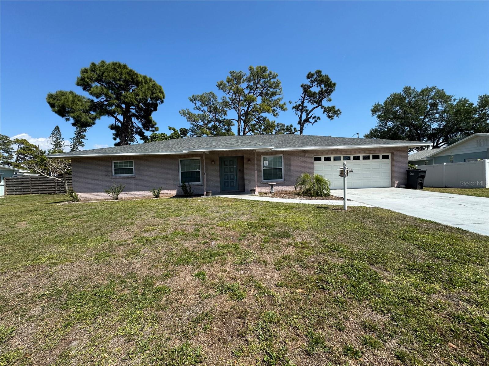 Bring your own creations into this home located the heart of Bradenton. Close to shopping, restaurants, and only 7 miles to beautiful Bradenton Beach. This home offers 3 bedrooms, 2 full bathrooms and 2 car garage. This home also boasts a separate living room that is simply enormous! Sliding doors will bring you out onto the generous paved patio and into the large fenced-in backyard with your own storage shed. A formal dining room and master suite add to the roomy feel of this home. New roof 2026. No HOA, no CDD. Some pictures in here had been virtually staged. Great for a handyman home or investor.